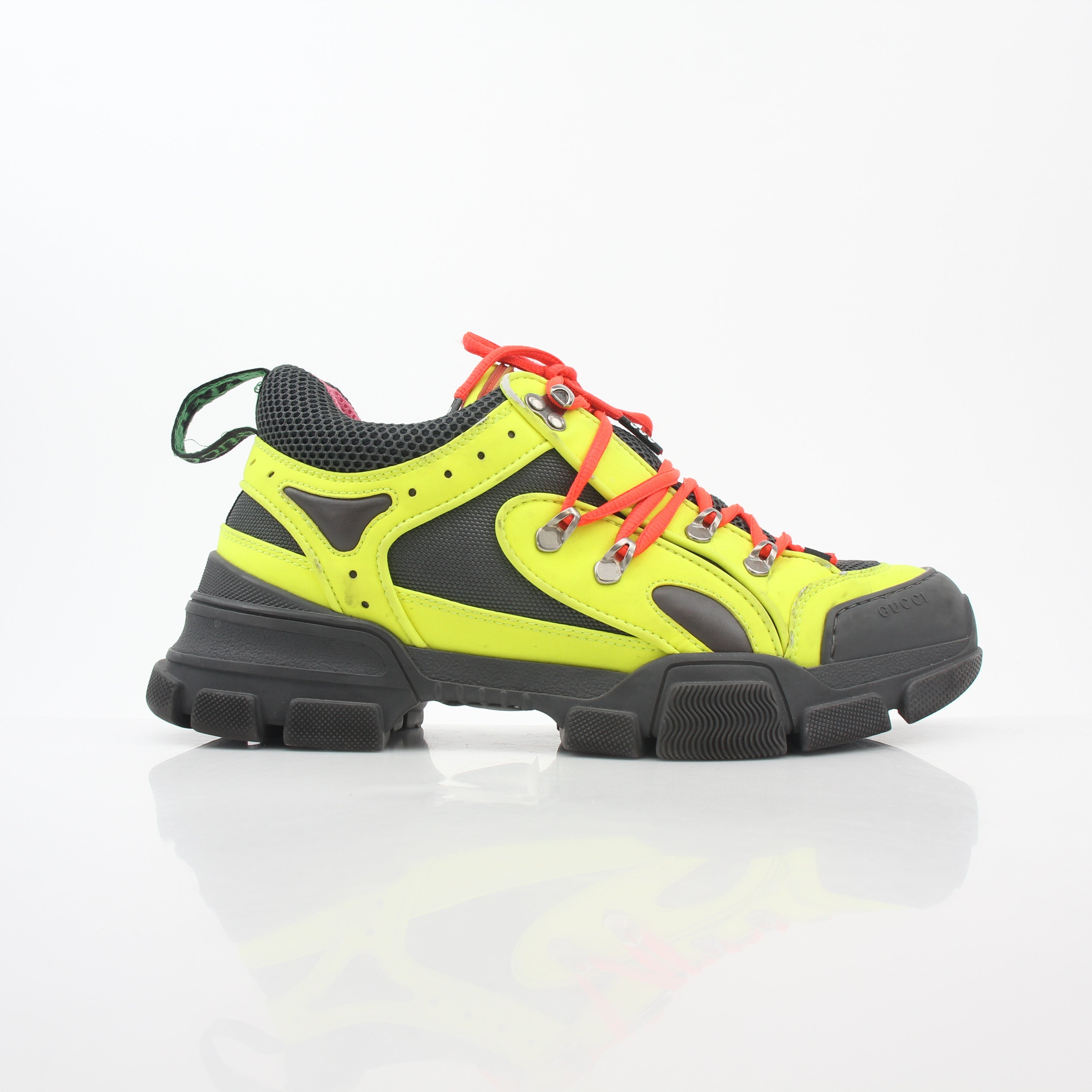 Gold & Beyond Gucci Neon Yellow Flashtrek reflective sneakers, stylish shoes with vibrant yellow and reflective details.