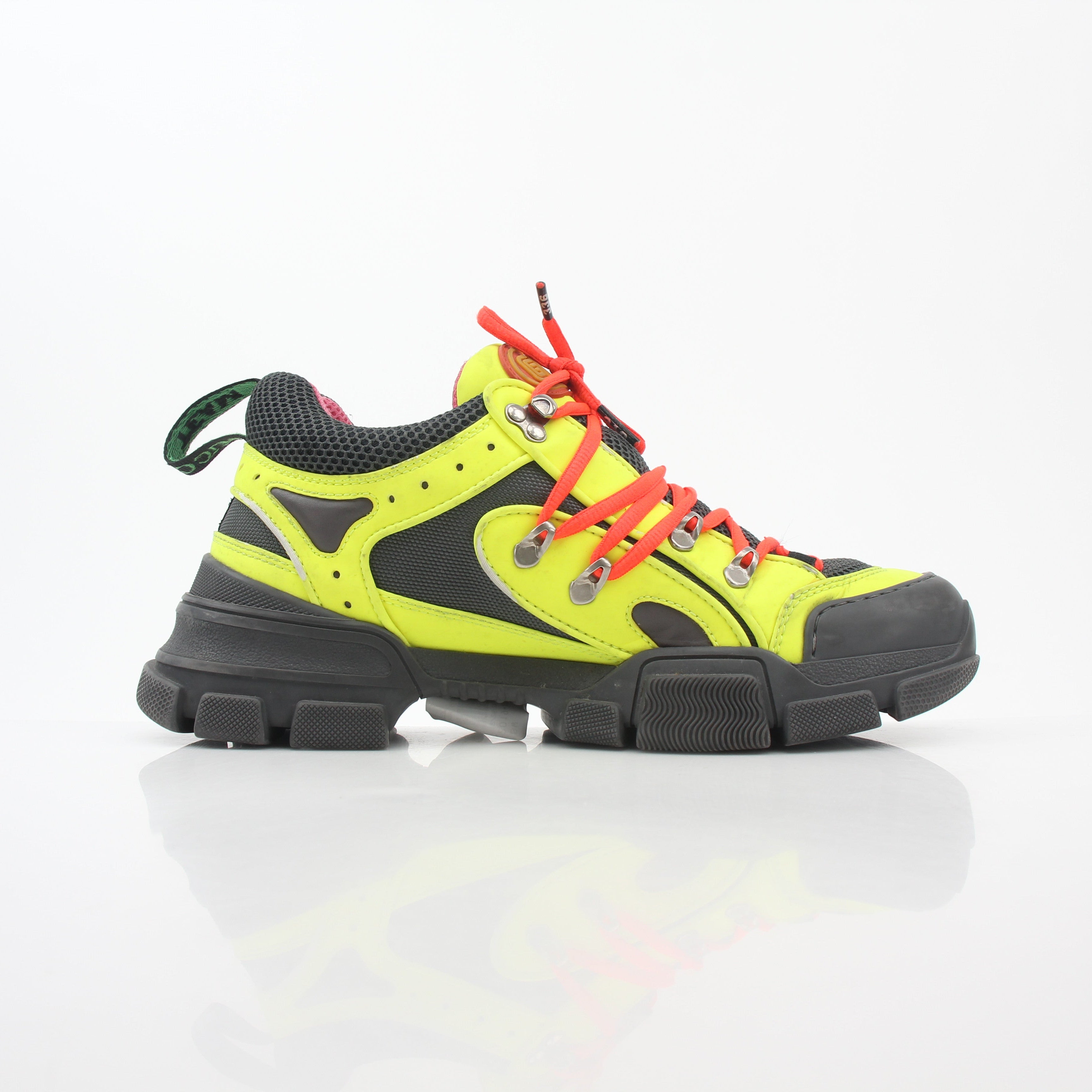 Gucci Neon Yellow Flashtrek Reflective Sneakers, stylish shoes with bright yellow and reflective design, worn on feet.