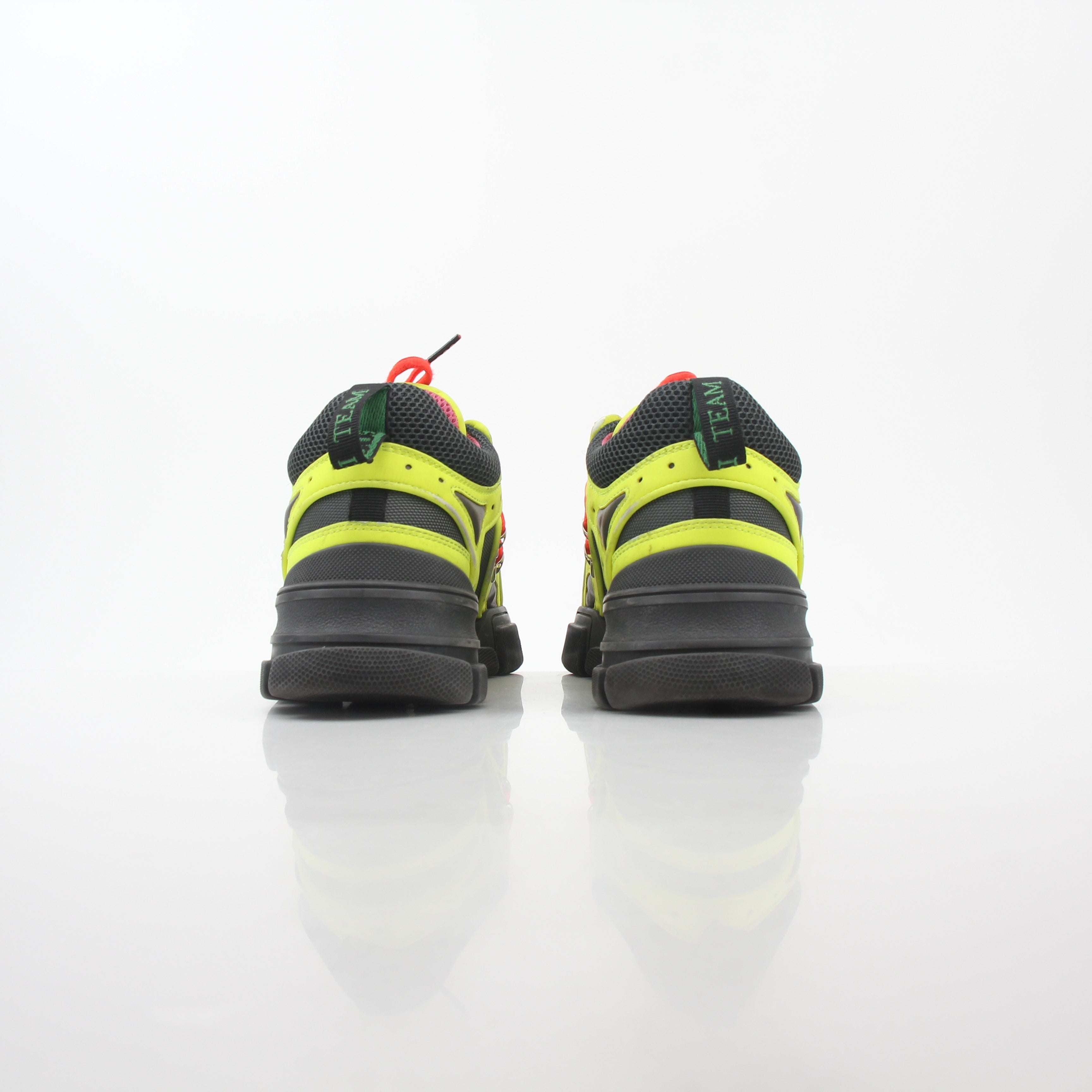 Gucci Neon Yellow Flashtrek Reflective Sneakers by Gold & Beyond, showing bright yellow and reflective details on sporty shoes.