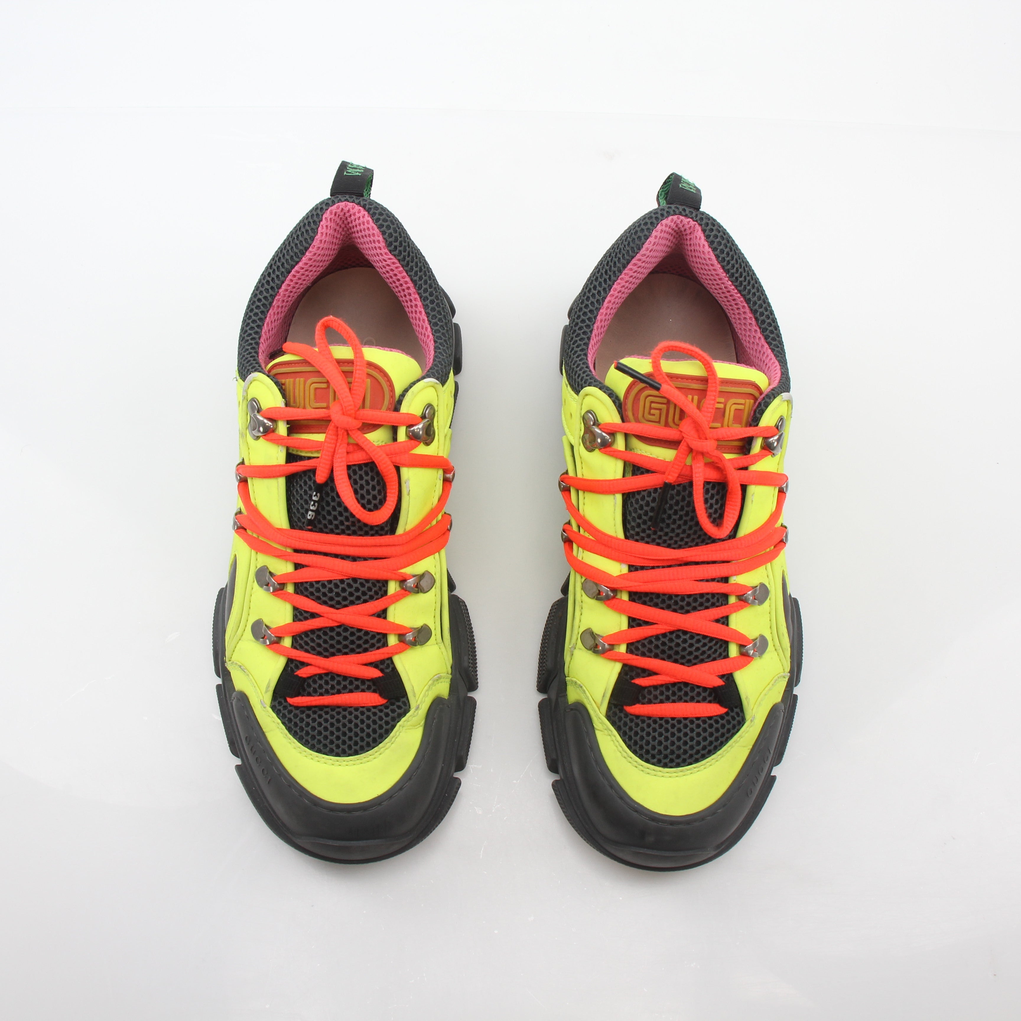 Gold & Beyond Gucci Neon Yellow Flashtrek Reflective Sneakers showcasing vibrant yellow and reflective details on sporty shoes.