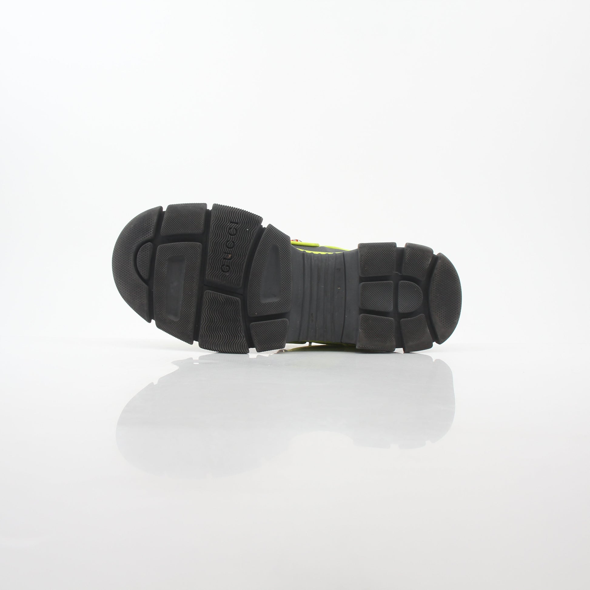 Reflective Gucci Neon Yellow Flashtrek sneakers with bold design and reflective accents, displayed on a white background.