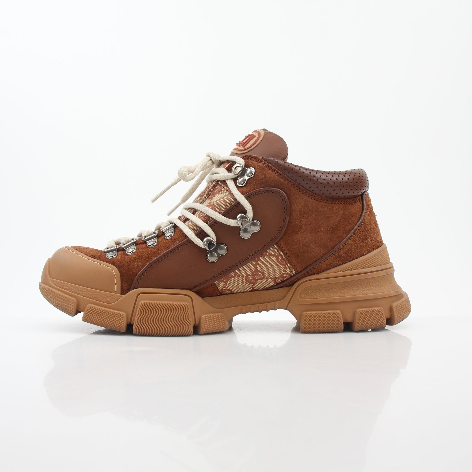 Gold & Beyond Gucci Brown GG Canvas Flashtrek mid-top sneakers with white soles and brown laces, stylish and comfortable shoes.