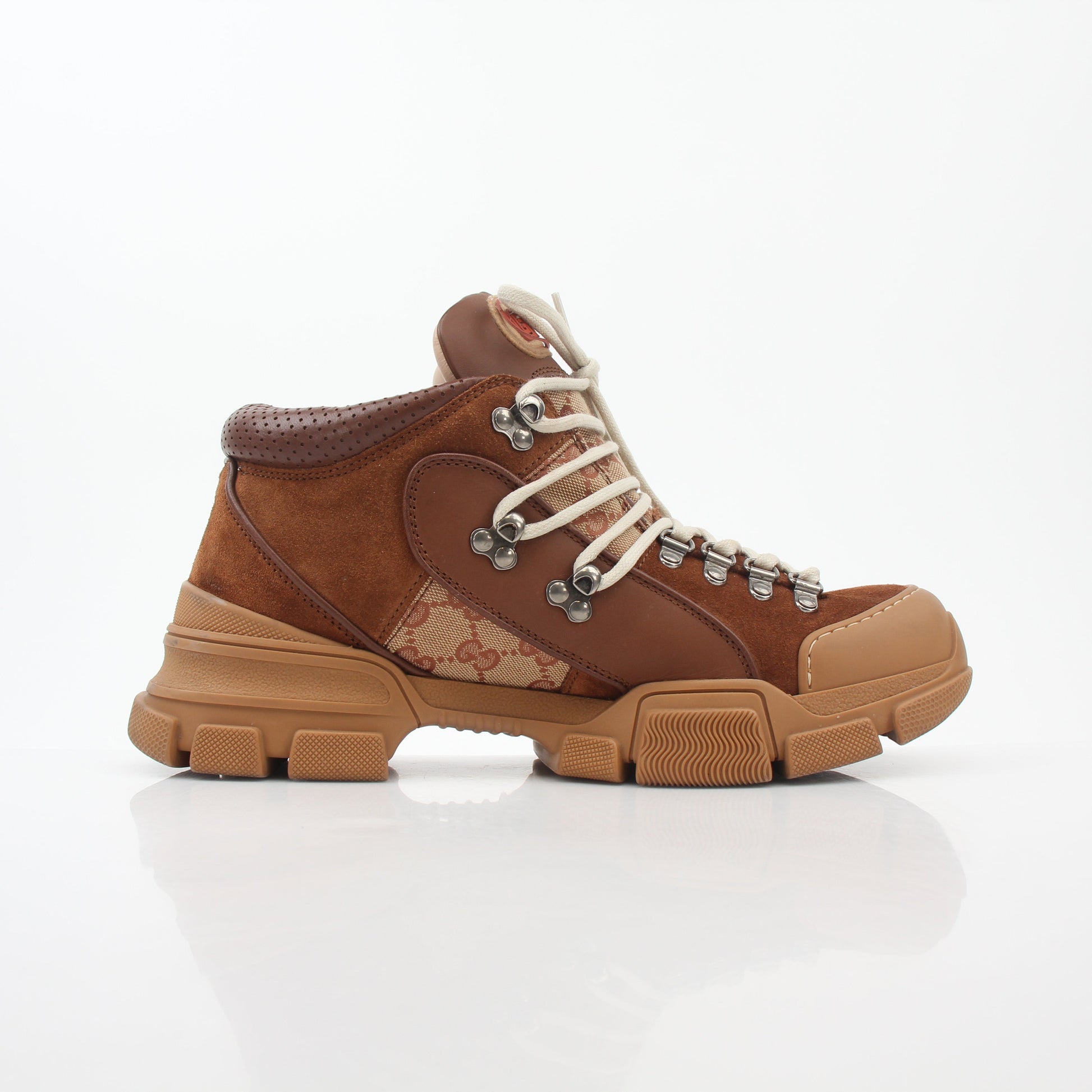 Gold & Beyond Gucci brown GG canvas Flashtrek mid-top sneakers with lace-up closure and stylish design.