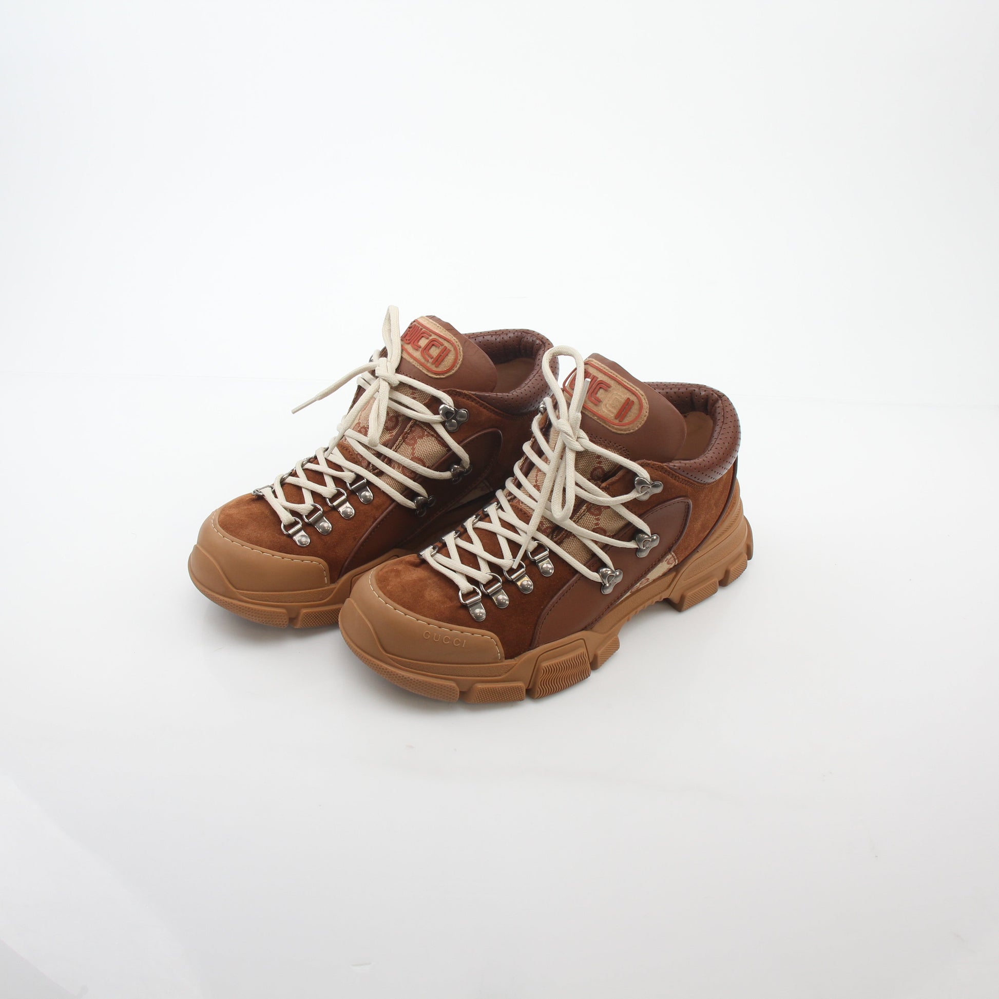 Gold & Beyond Gucci brown GG canvas Flashtrek mid-top sneakers with white soles and brown laces, stylish casual shoes.