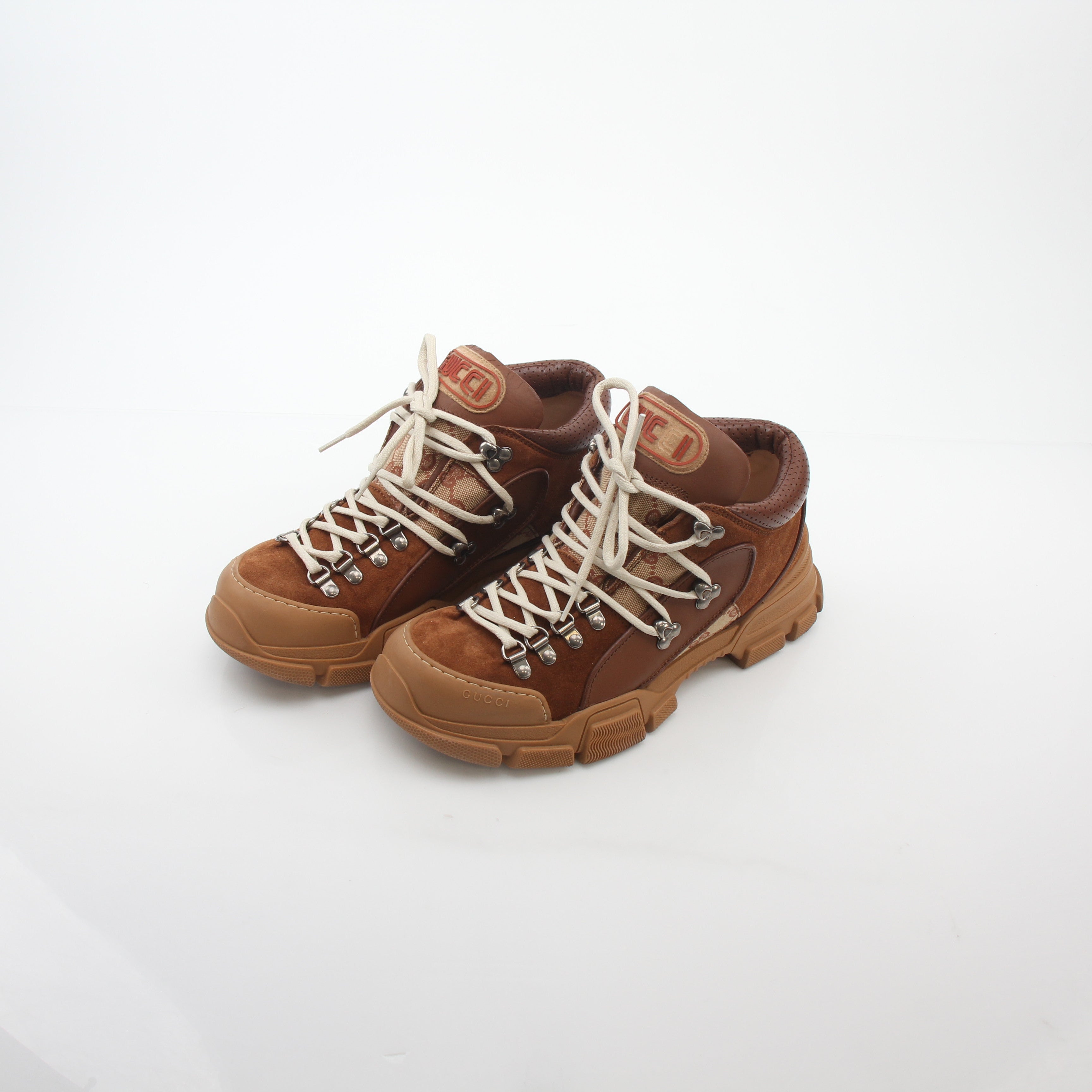 Gold & Beyond Gucci brown GG canvas Flashtrek mid-top sneakers with white soles and brown laces, stylish casual shoes.