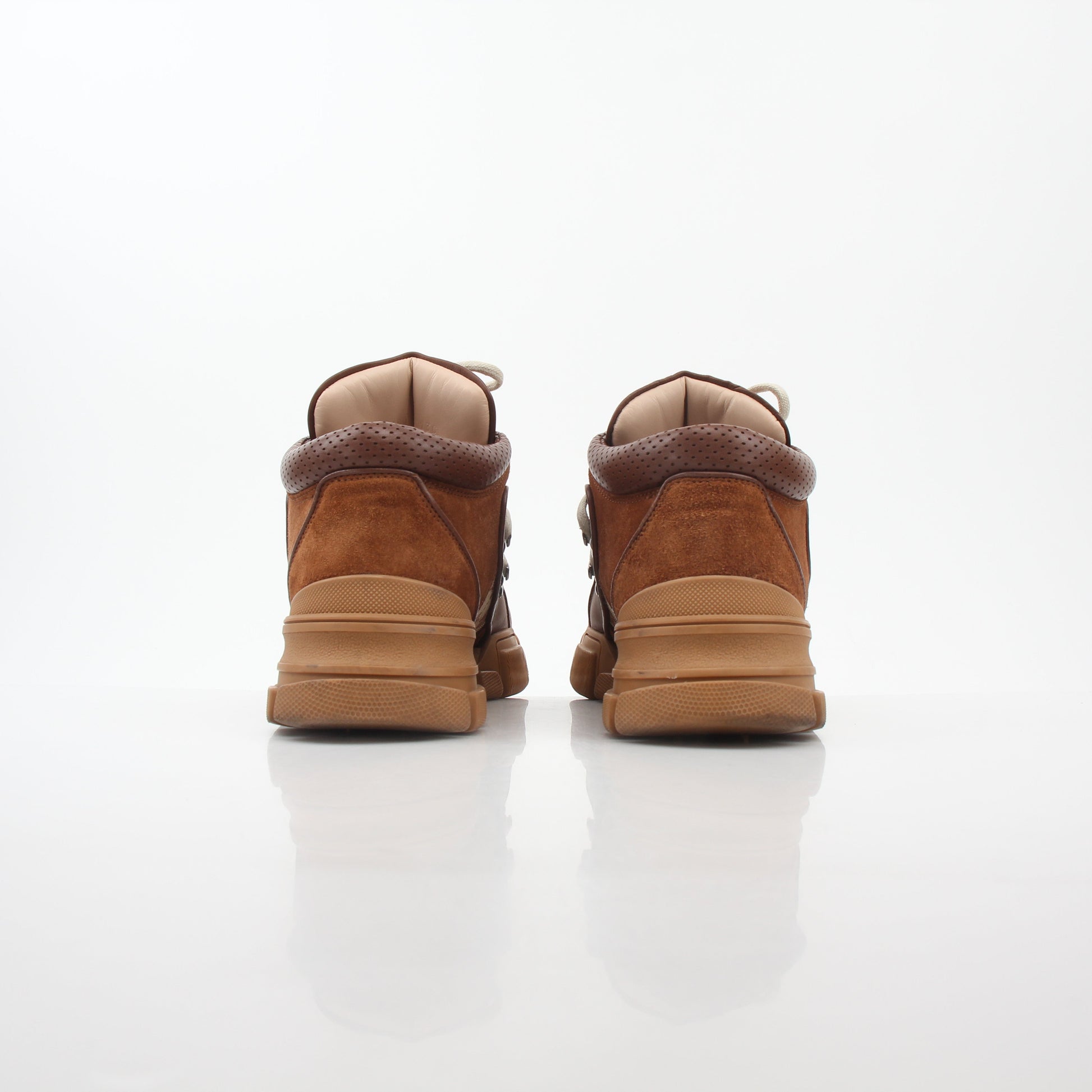 Gold & Beyond Gucci Brown GG Canvas Flashtrek mid-top sneakers with stylish design and white rubber soles.
