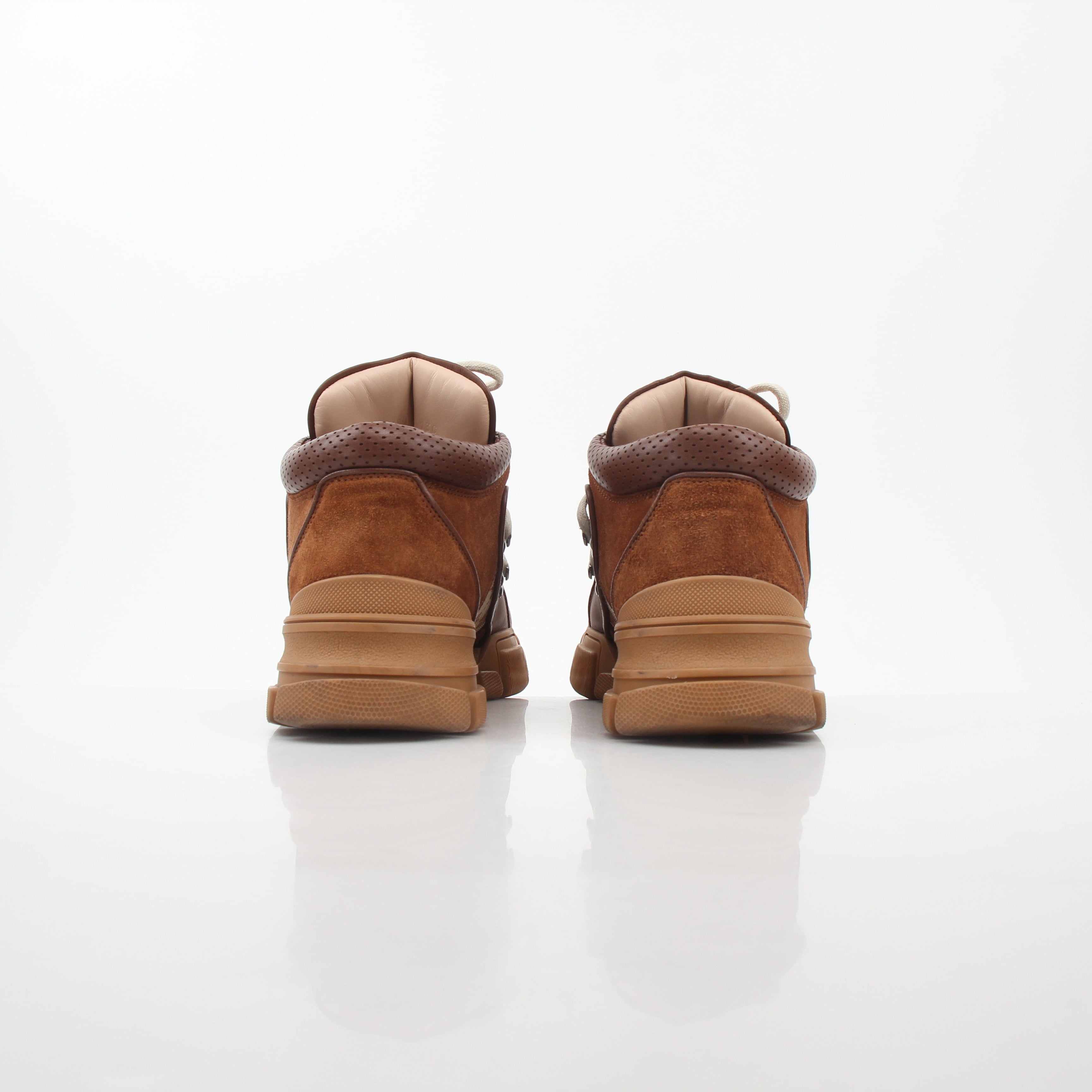 Gold & Beyond Gucci Brown GG Canvas Flashtrek mid-top sneakers with stylish design and white rubber soles.