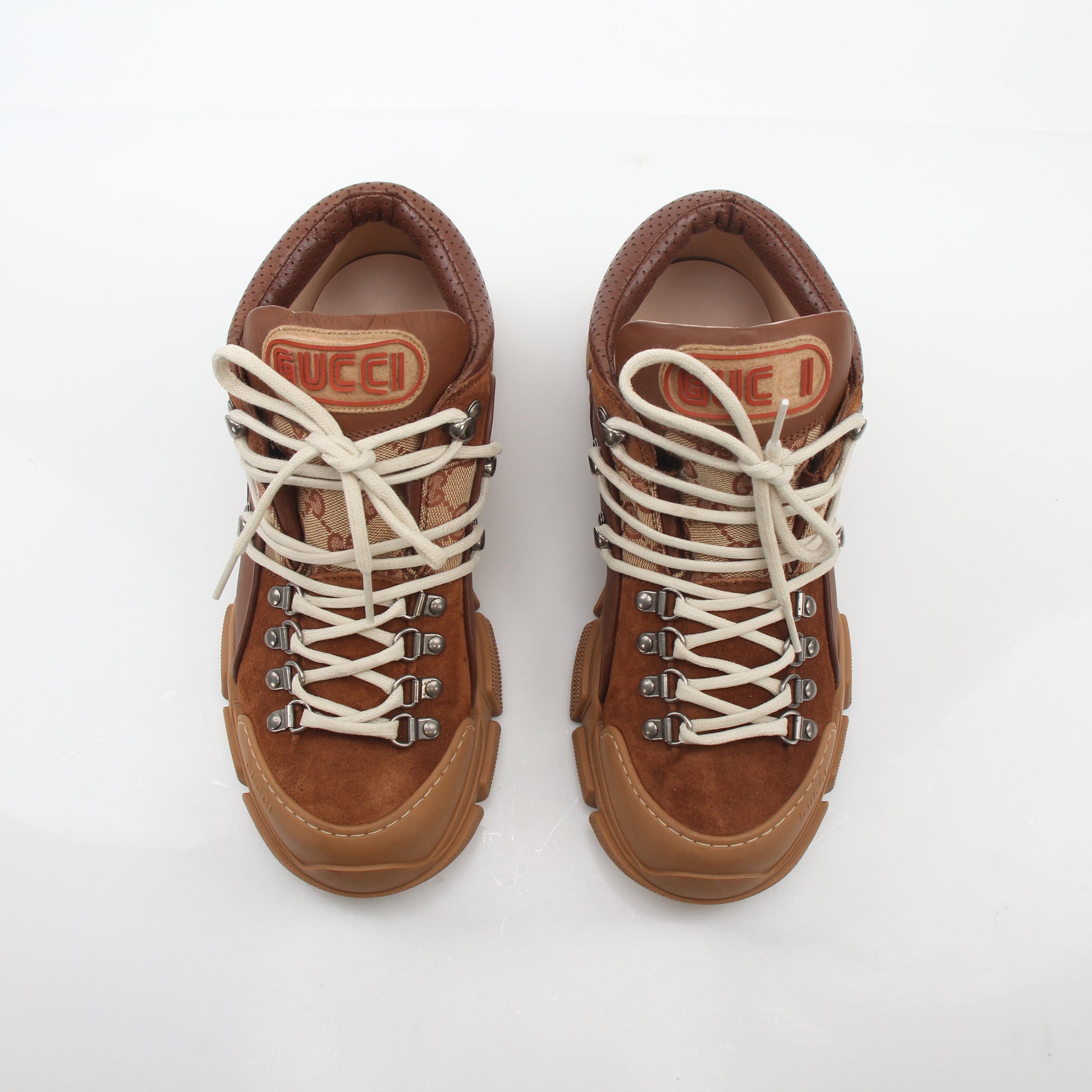 Gold & Beyond Gucci brown GG canvas Flashtrek mid-top sneakers with white sole and lace-up design, stylish casual shoes for men.