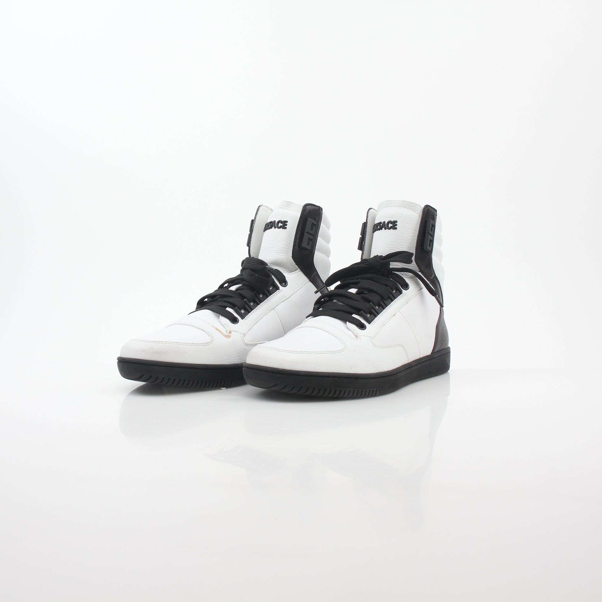 Versace White and Black Greca Key high-top sneakers by Gold & Beyond, featuring signature Greek key design and stylish shoe details.