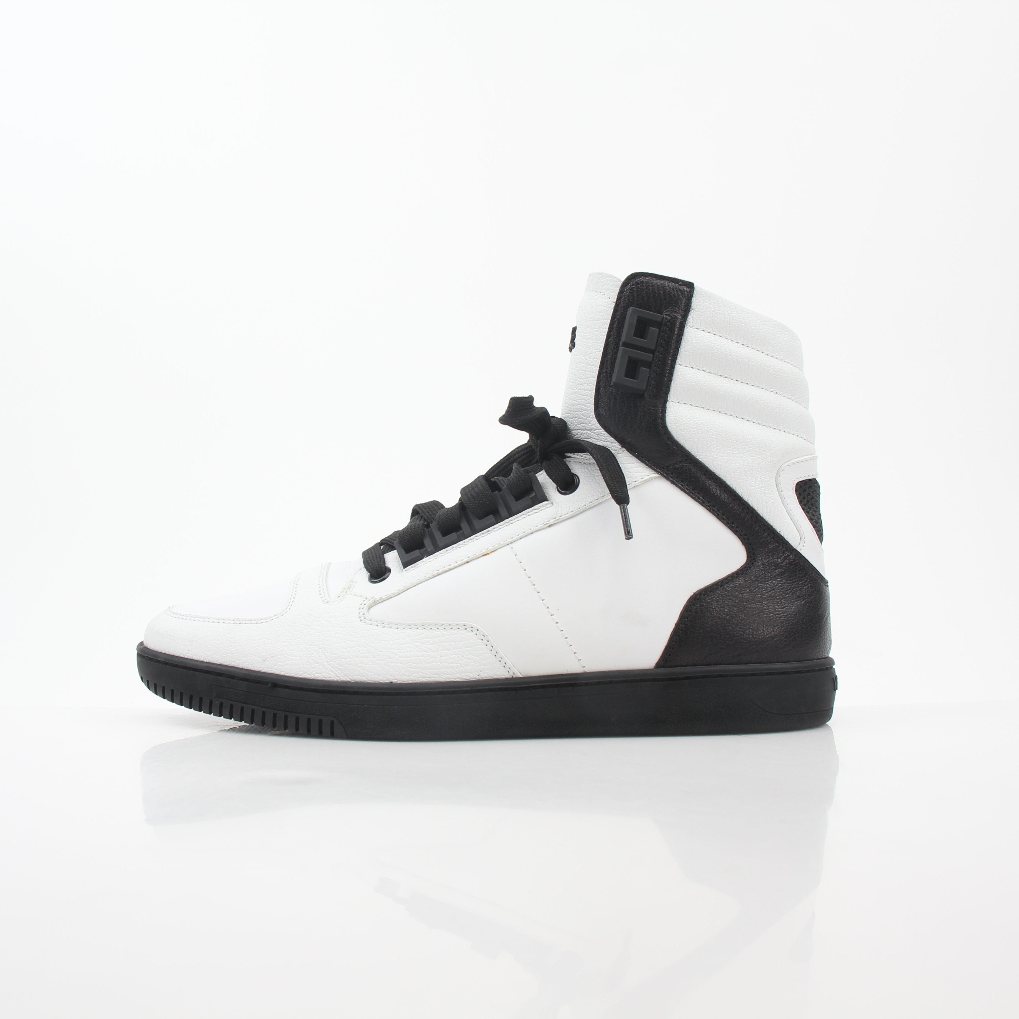Gold & Beyond Versace white and black Greca Key high-top sneakers featuring bold design and iconic Greek key pattern.