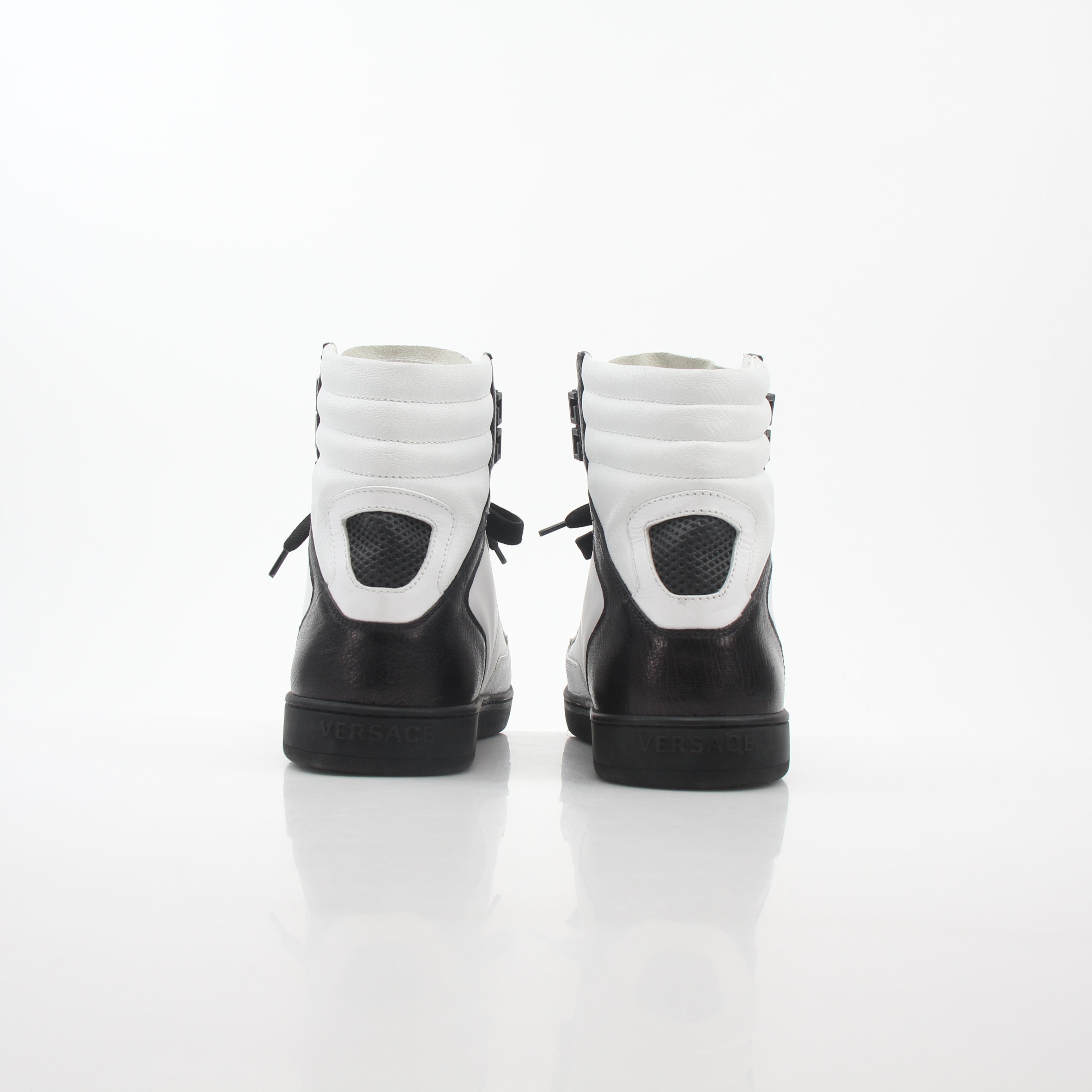 Gold & Beyond Versace White and Black Greca Key high-top sneakers with bold pattern and stylish design.