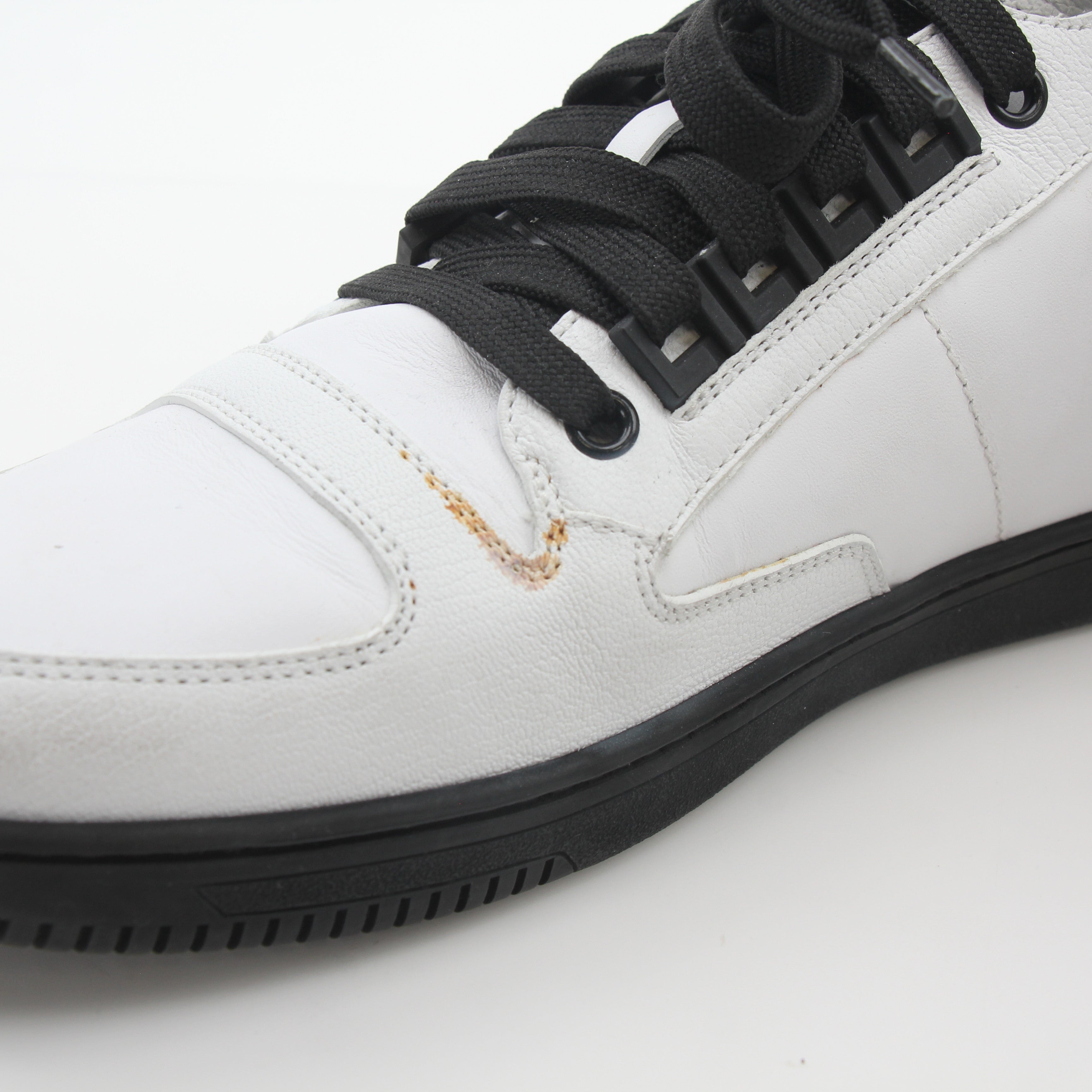Gold & Beyond Versace White and Black Greca Key high-top sneakers with logo details and stylish design on a clean background.