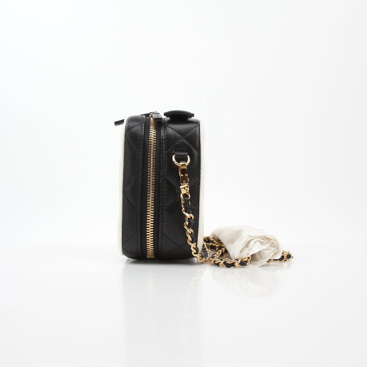 Gold & Beyond Chanel white and black small CC filigree vanity case with elegant design and compact size.