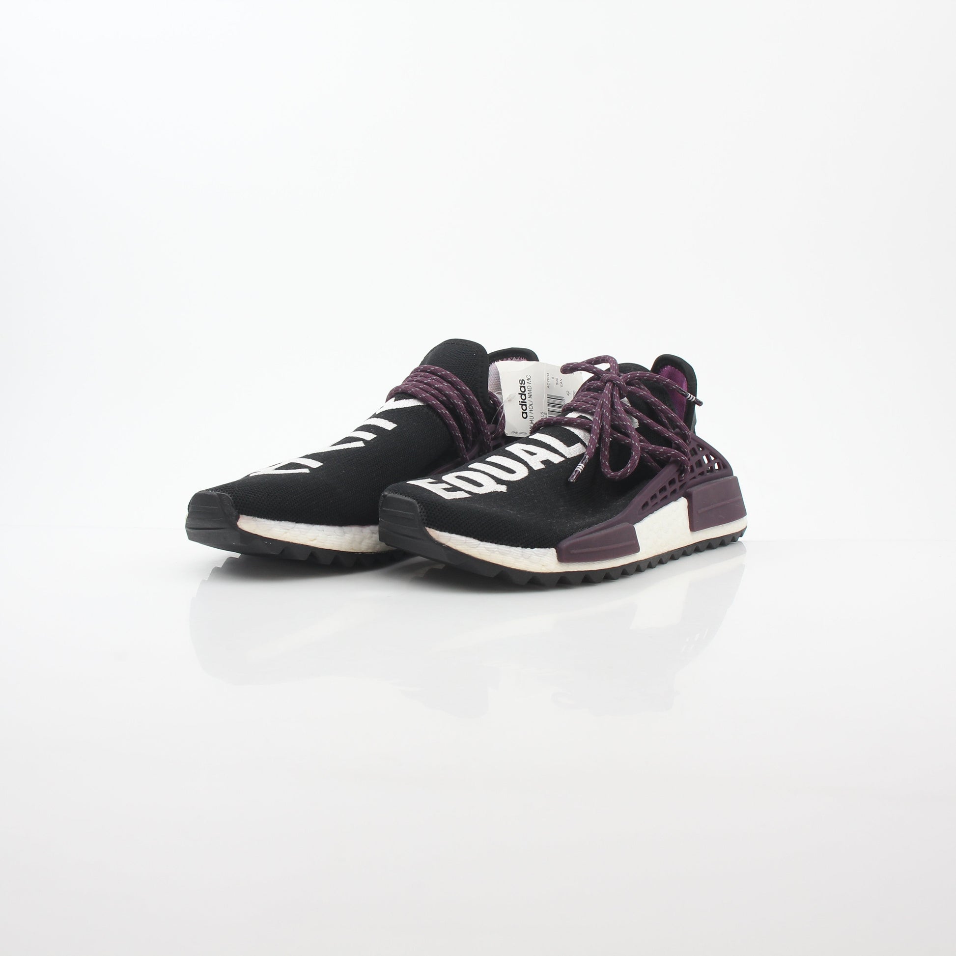 Adidas x Pharrell Williams NMD Hu Trail Holi Equality sneakers in vibrant colors, displayed on a white background.