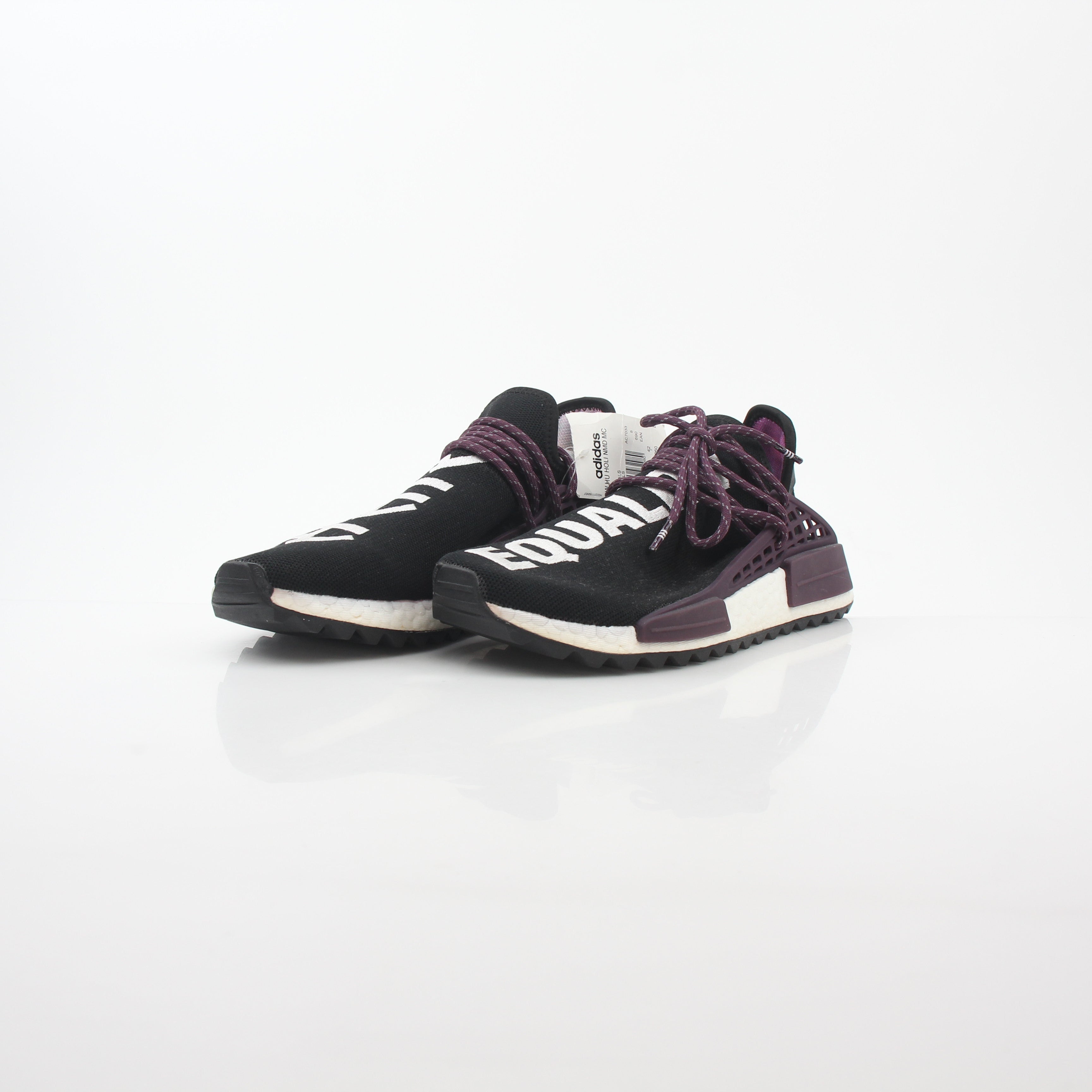 Adidas x Pharrell Williams NMD Hu Trail Holi Equality sneakers in vibrant colors, displayed on a white background.