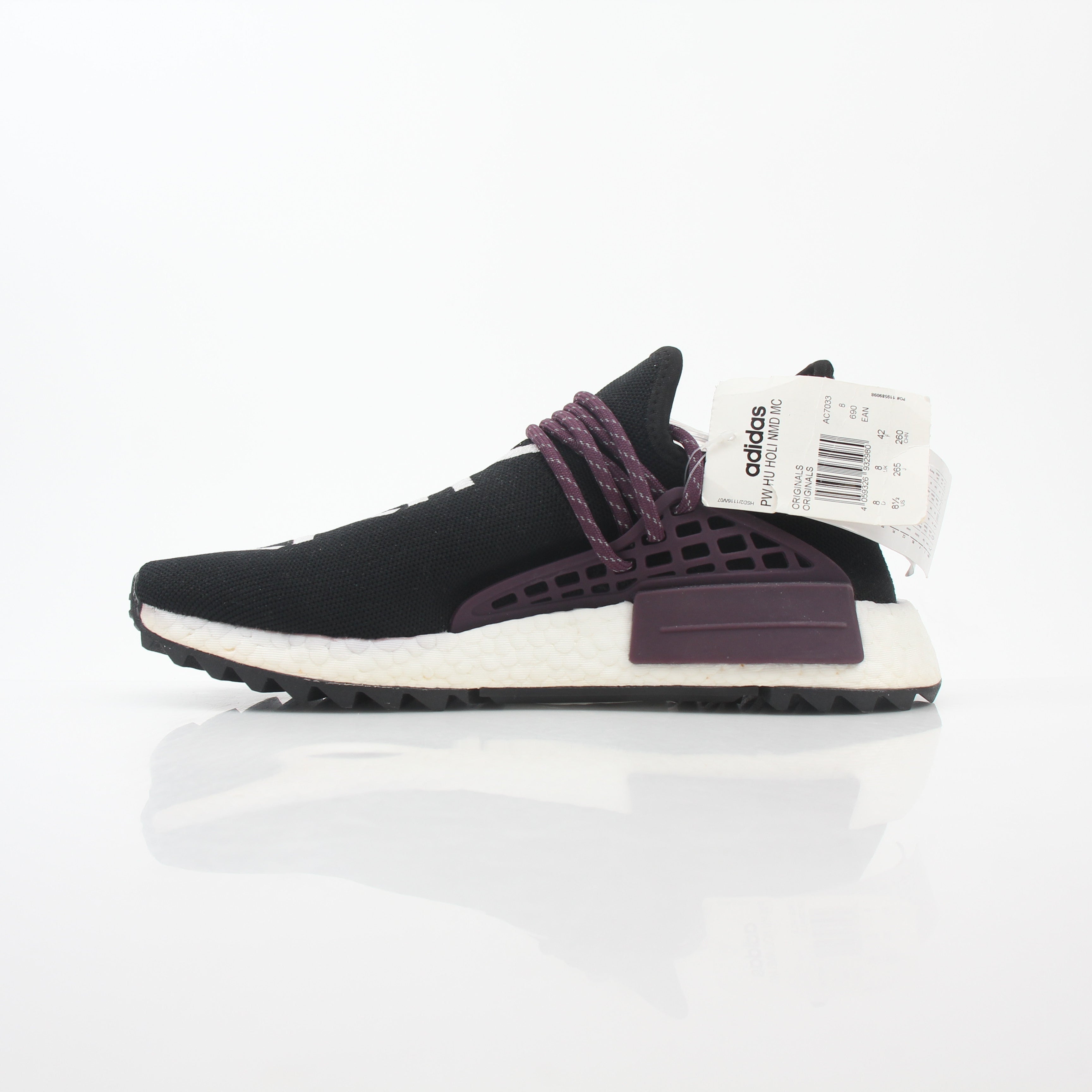 Adidas x Pharrell Williams NMD Hu Trail Holi Equality sneakers in vibrant colors, displayed on a plain background.