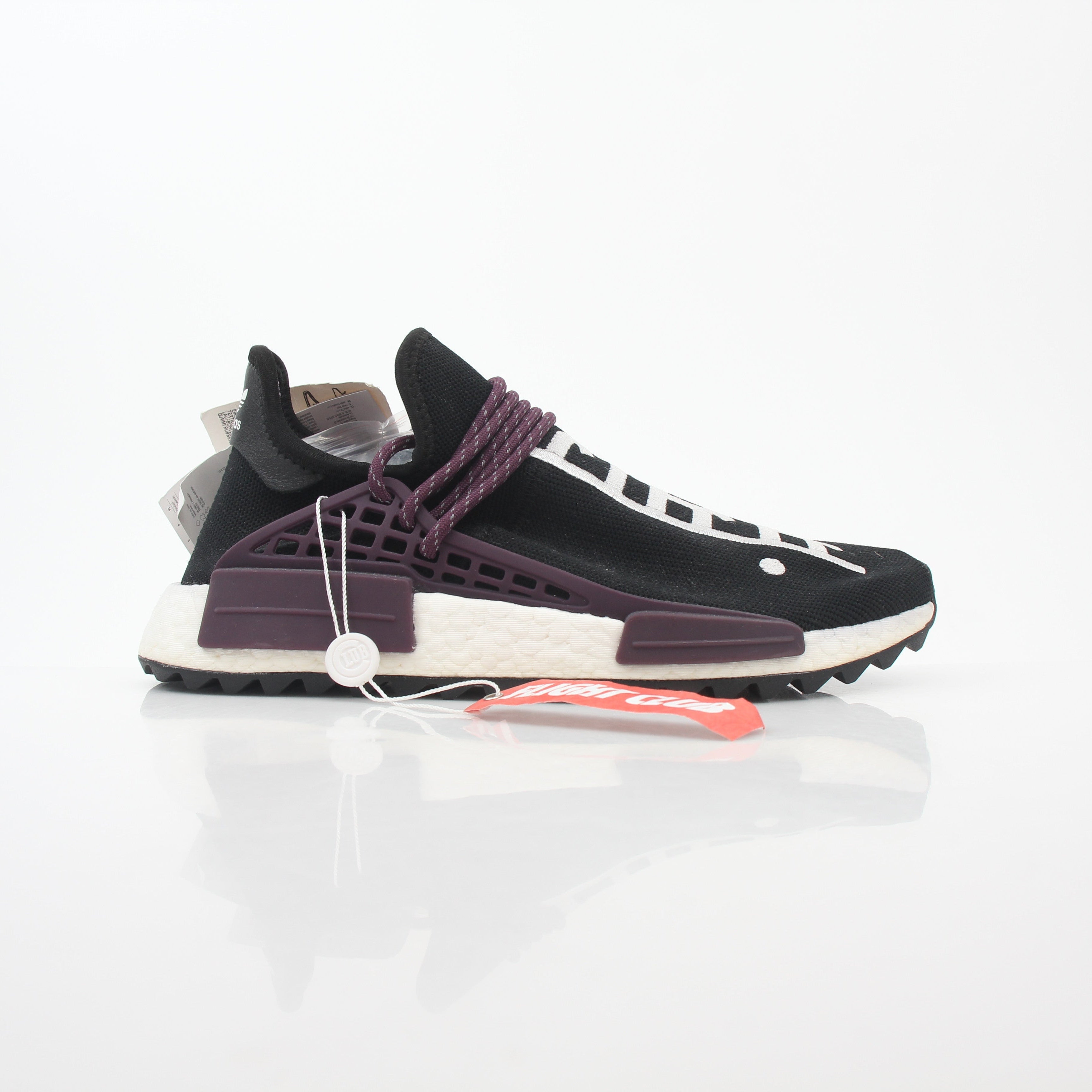 Adidas x Pharrell Williams NMD Hu Trail Holi Equality sneakers in vibrant colors, displayed on a white background.