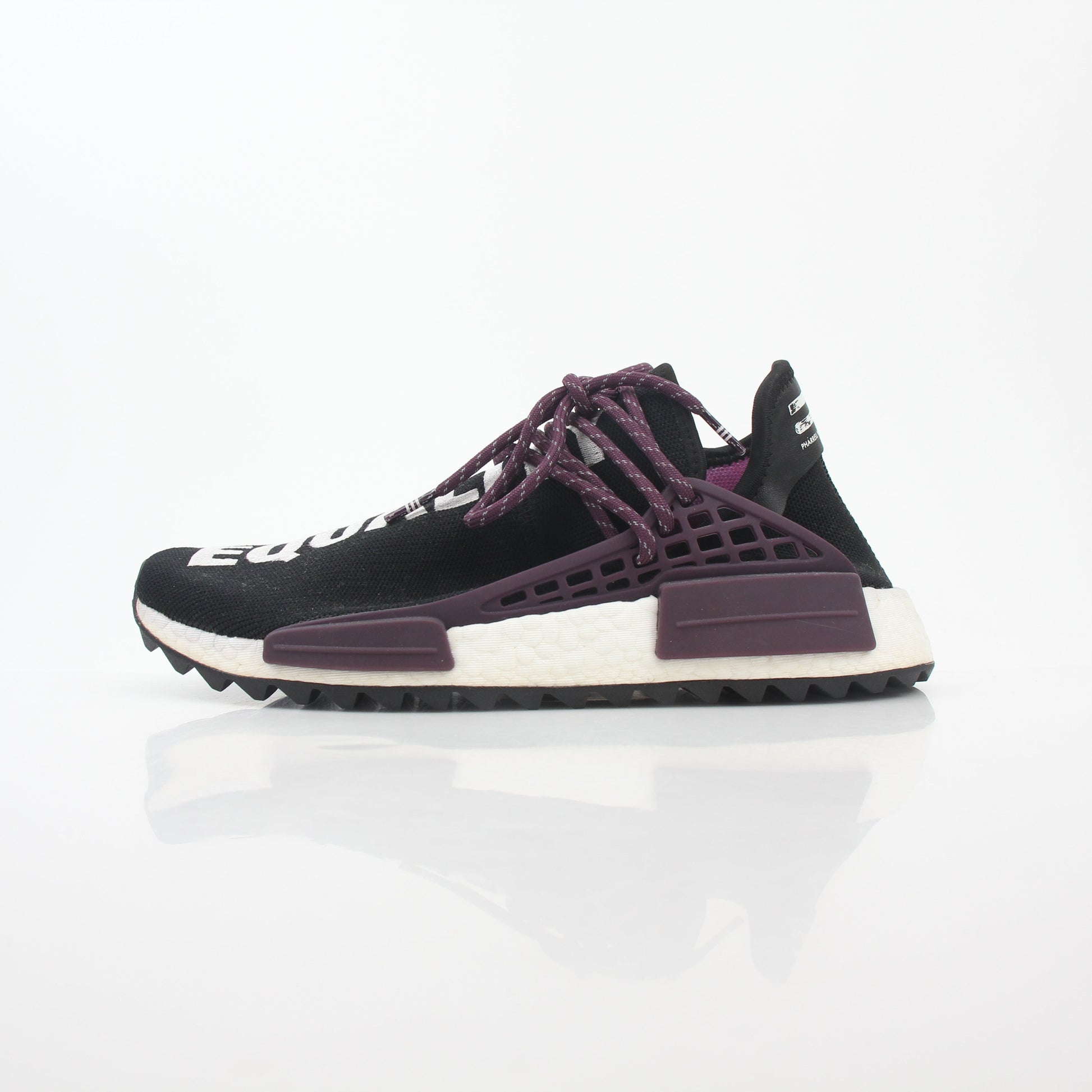 Adidas x Pharrell Williams NMD Hu Trail Holi Equality sneakers in vibrant colors on a white background.