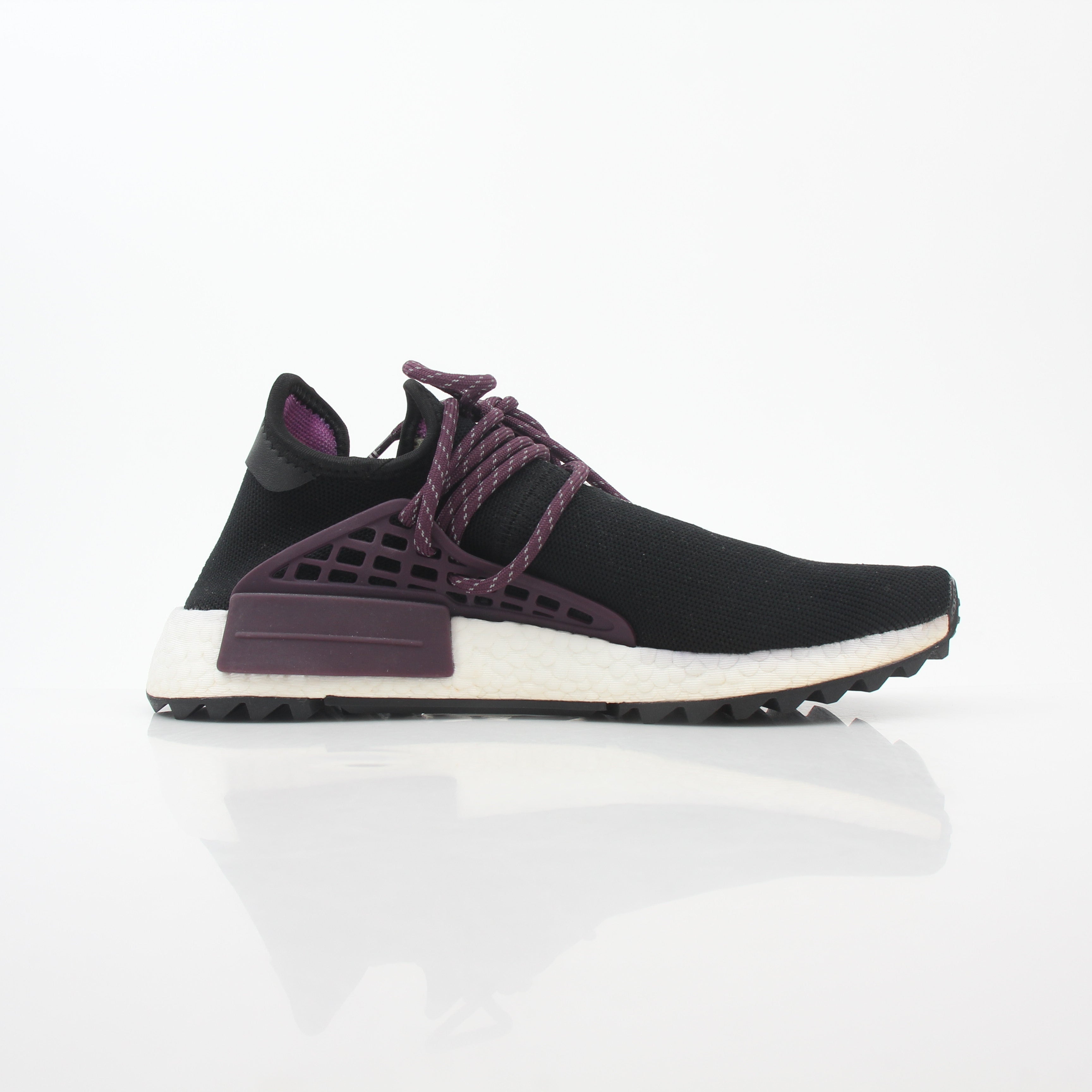 Adidas x Pharrell Williams NMD Hu Trail Holi Equality sneakers in vibrant colors, displayed on a plain background.