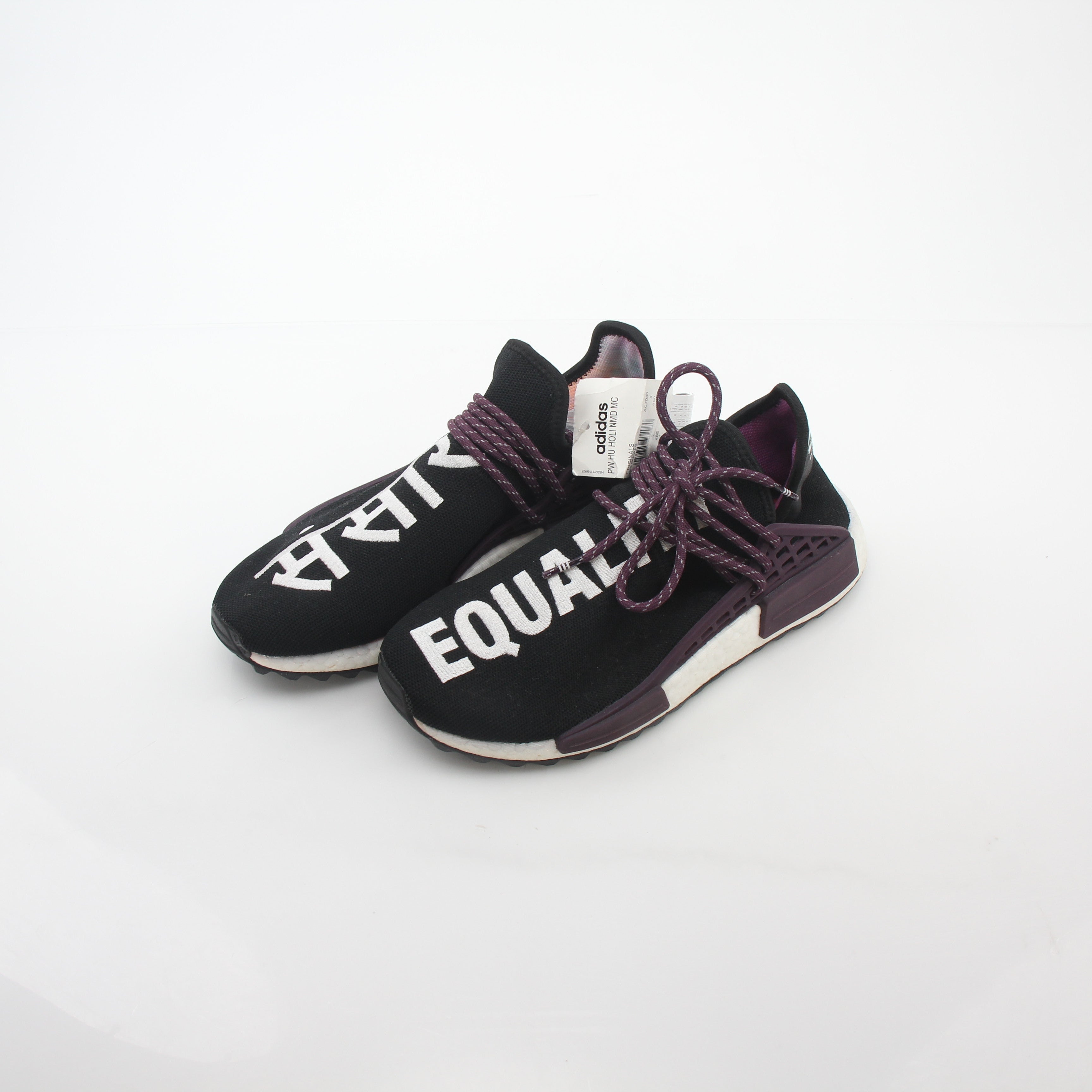 Adidas x Pharrell Williams NMD Hu Trail Holi Equality sneakers in vibrant colors, displayed on a white background.