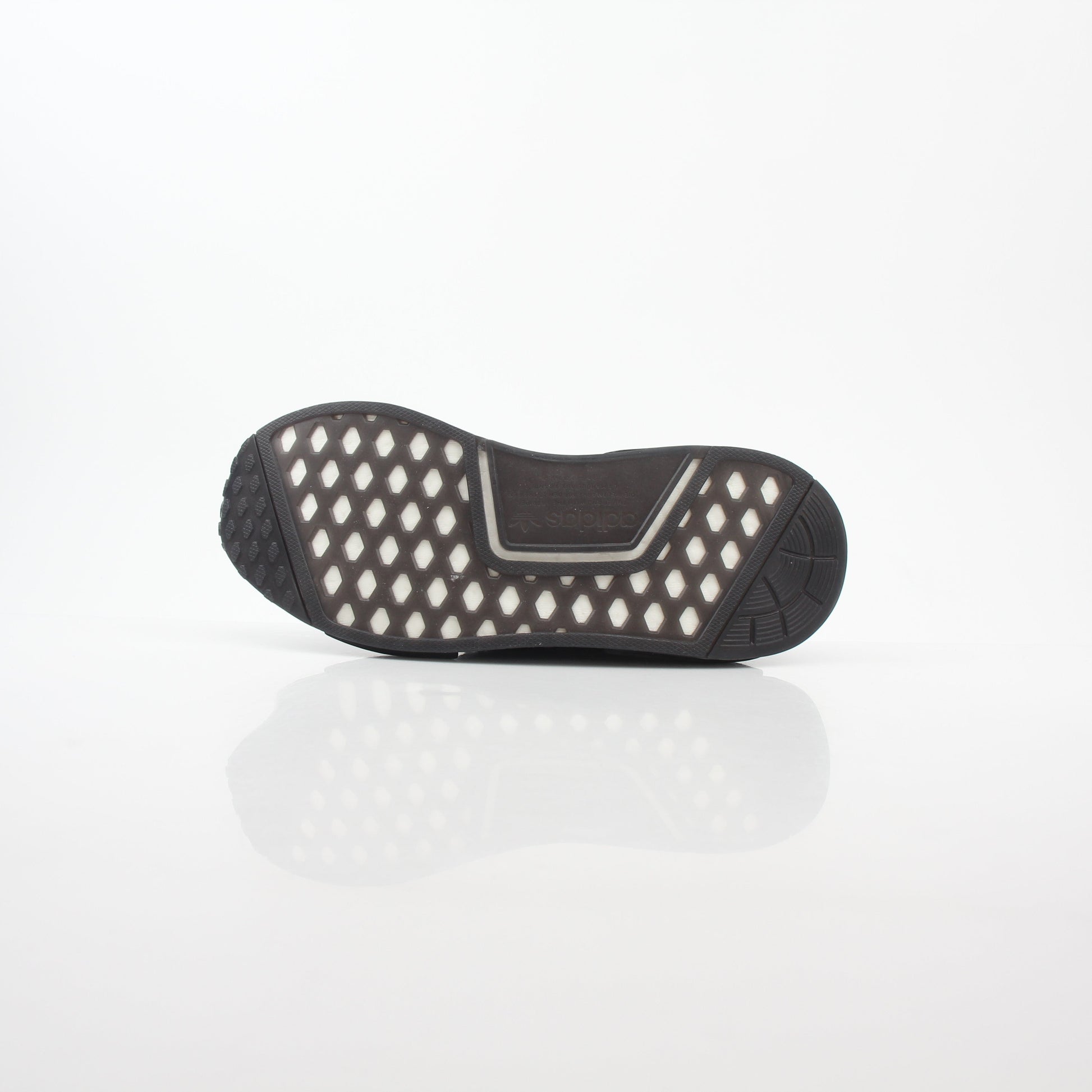 Adidas NMD R1 STLT Triple Black Primeknit sneakers with Boost midsole and sleek black design, displayed on a white background.