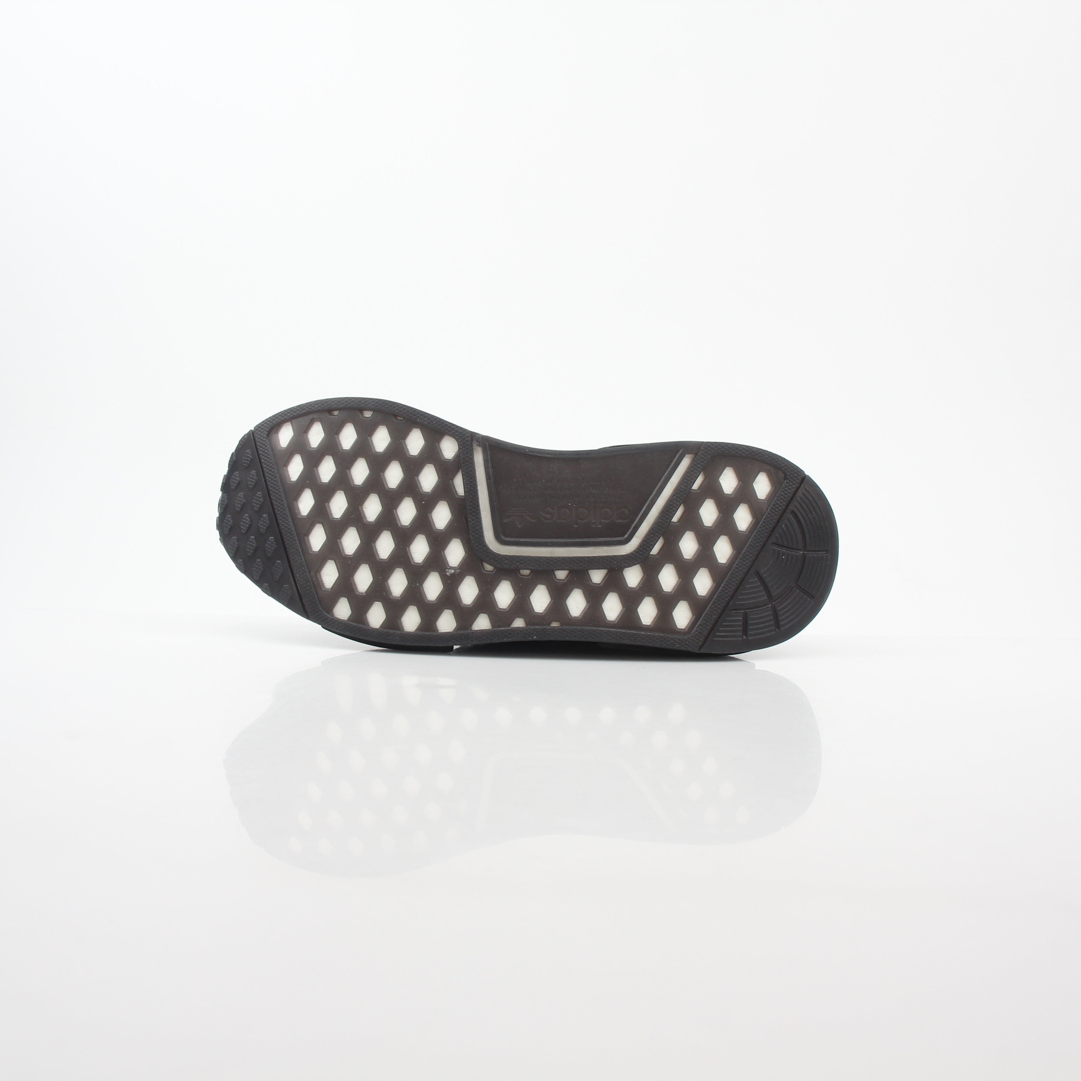 Adidas NMD R1 STLT Triple Black Primeknit sneakers with Boost midsole and sleek black design, displayed on a white background.