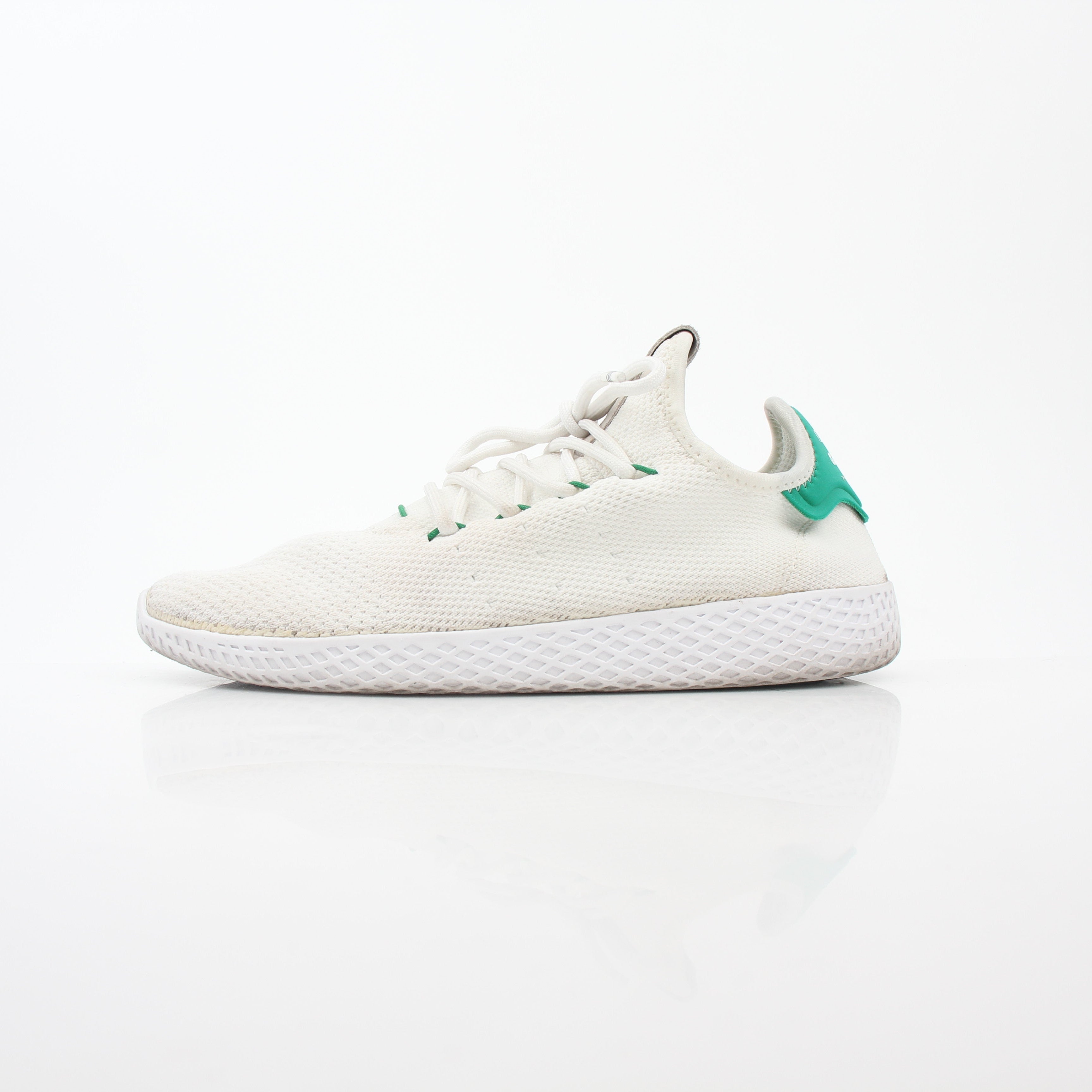 Adidas x Pharrell Williams Tennis Hu white and green sneakers with sleek design and breathable material.