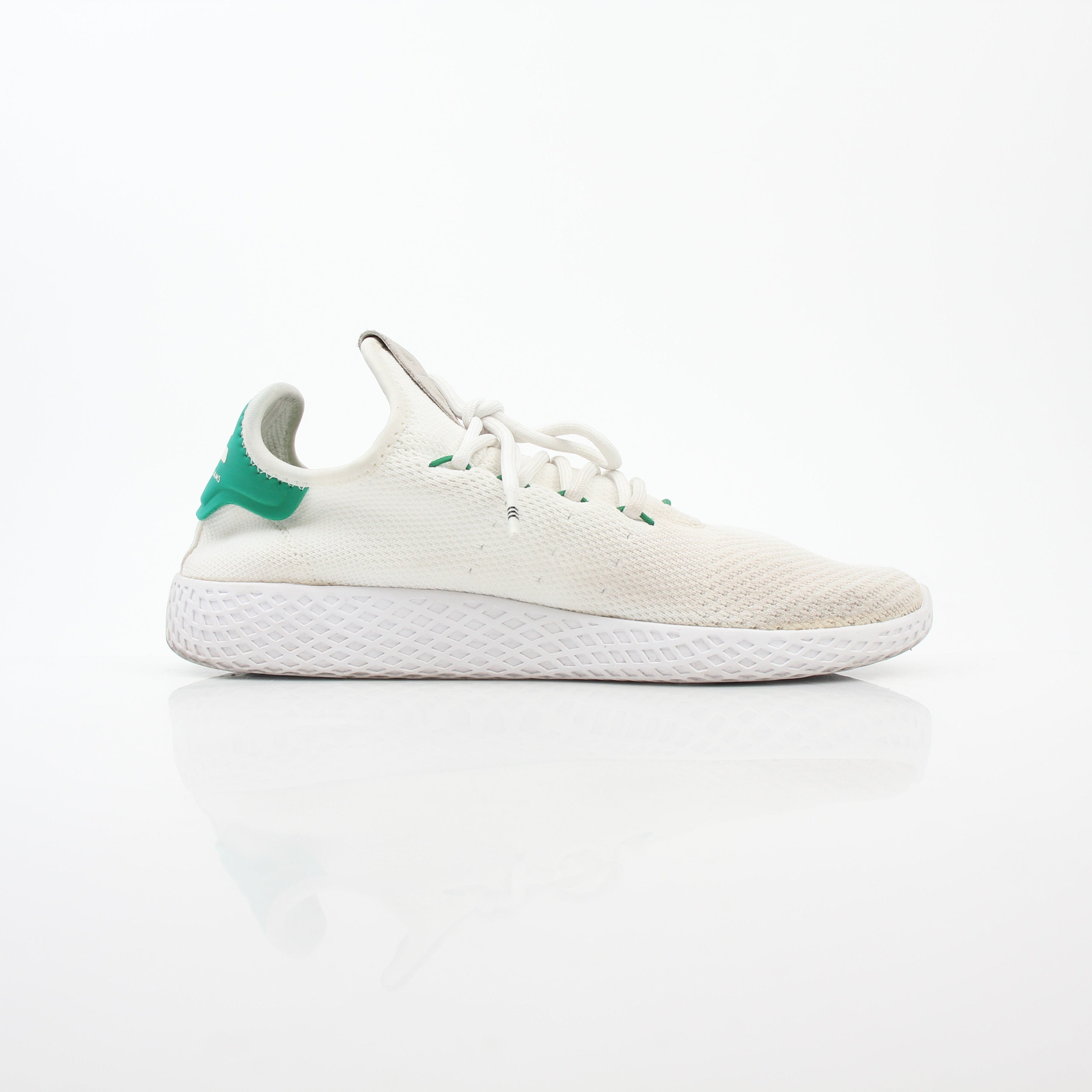 Adidas x Pharrell Williams Tennis Hu white and green sneakers with stylish design and textured sole.
