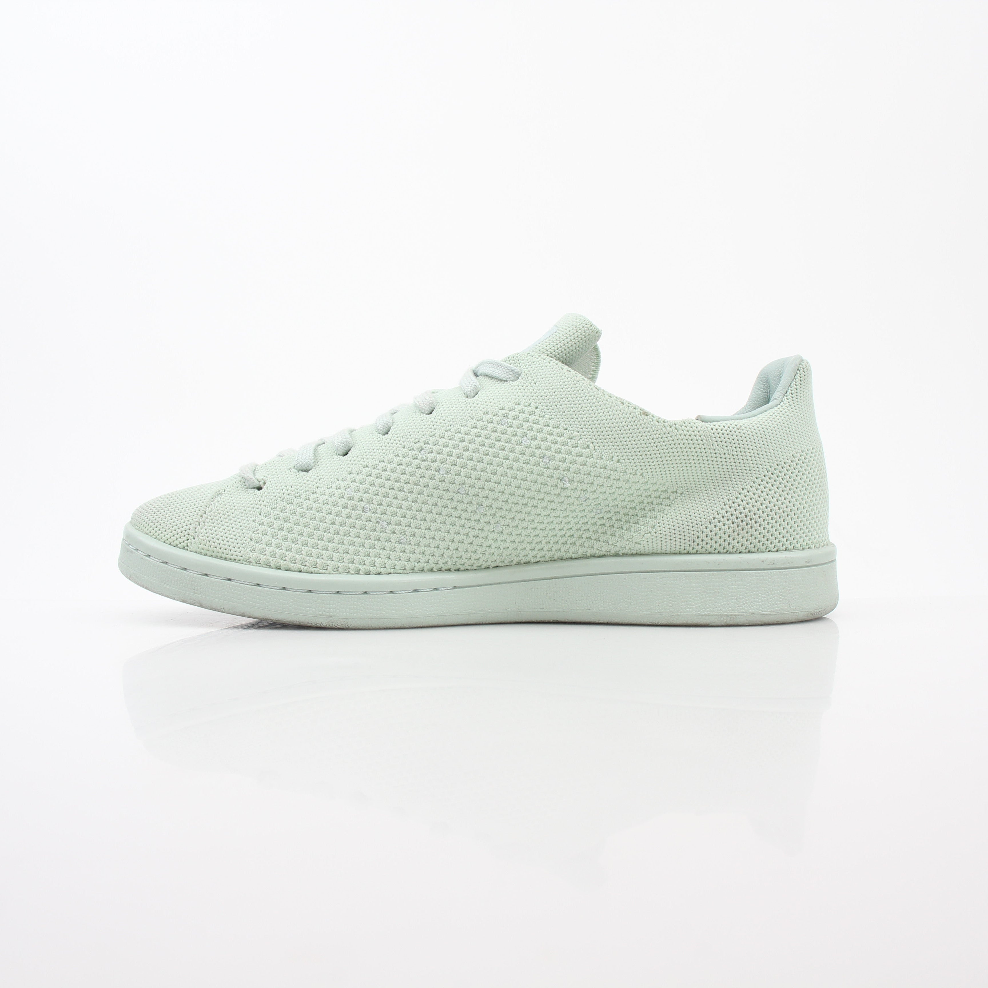 Gold & Beyond Adidas Stan Smith Primeknit Vapour Green sneakers, showcasing the sleek, green knitted upper and classic white sole.