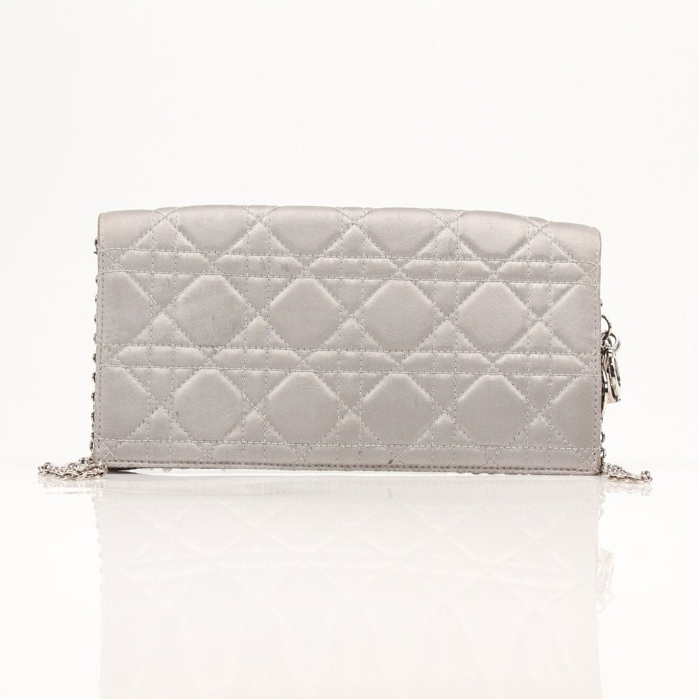 Christian Dior gray satin Cannage clutch wallet with gold accents, featuring a quilted design and elegant stitching.