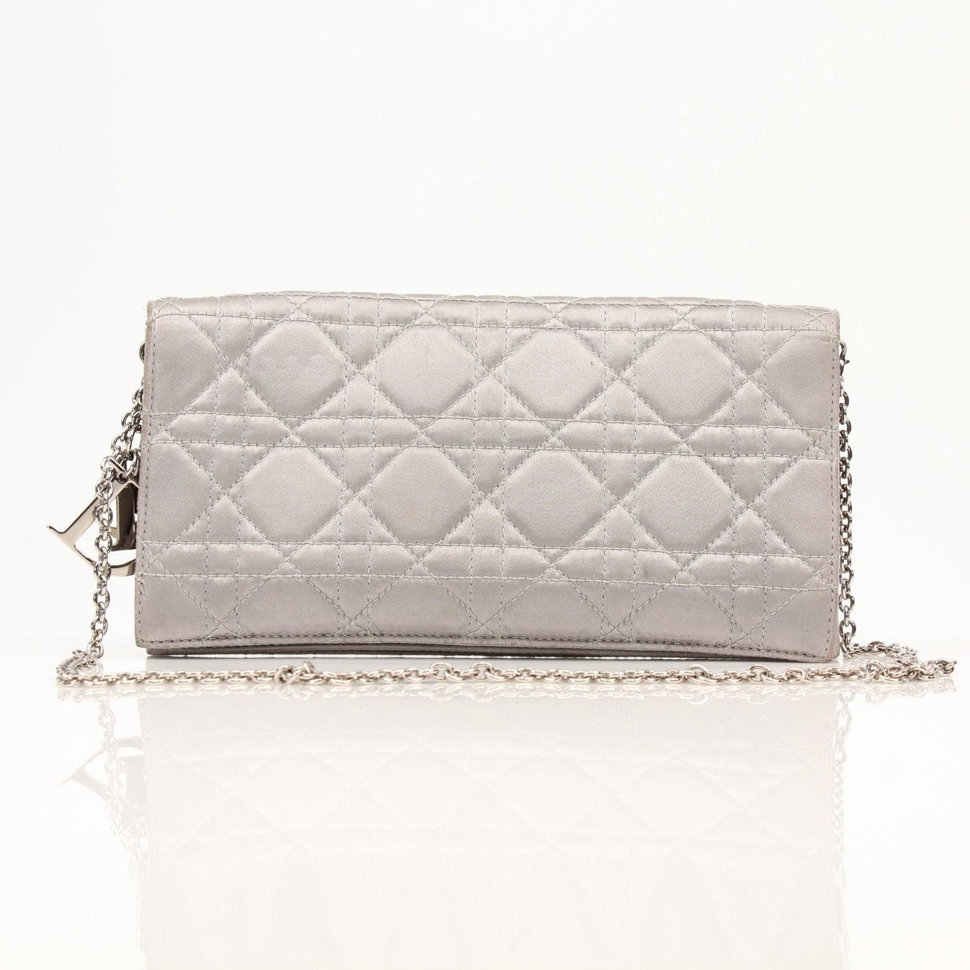 Gray satin Christian Dior Cannage clutch wallet with gold accents, featuring a quilted design and elegant style.