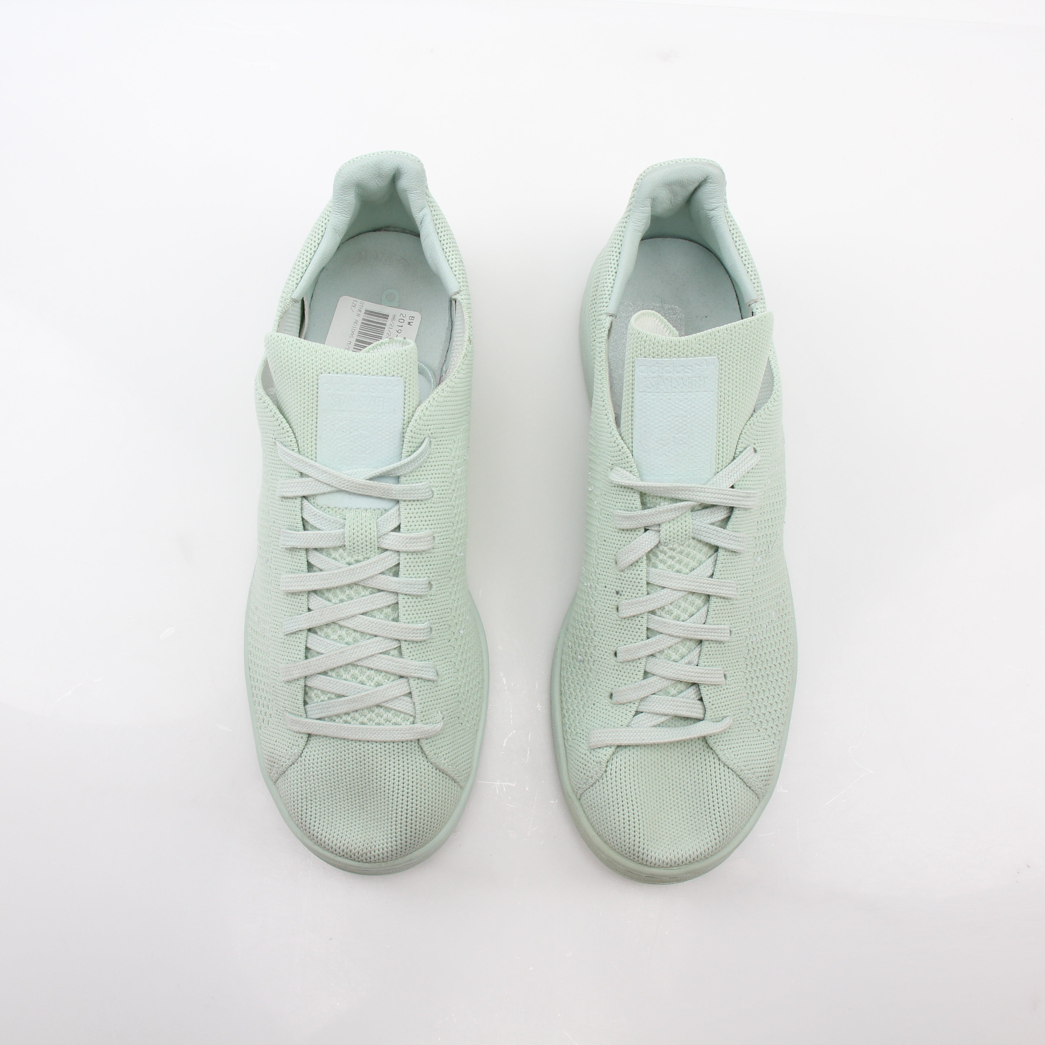 Gold & Beyond Adidas Stan Smith Primeknit Vapour Green sneakers with white soles and sleek knit upper, casual shoe design.