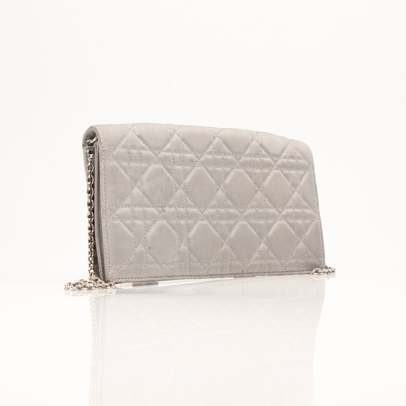 Gray satin Christian Dior Cannage clutch wallet with gold-tone hardware and quilted design, featuring a sleek, elegant look.