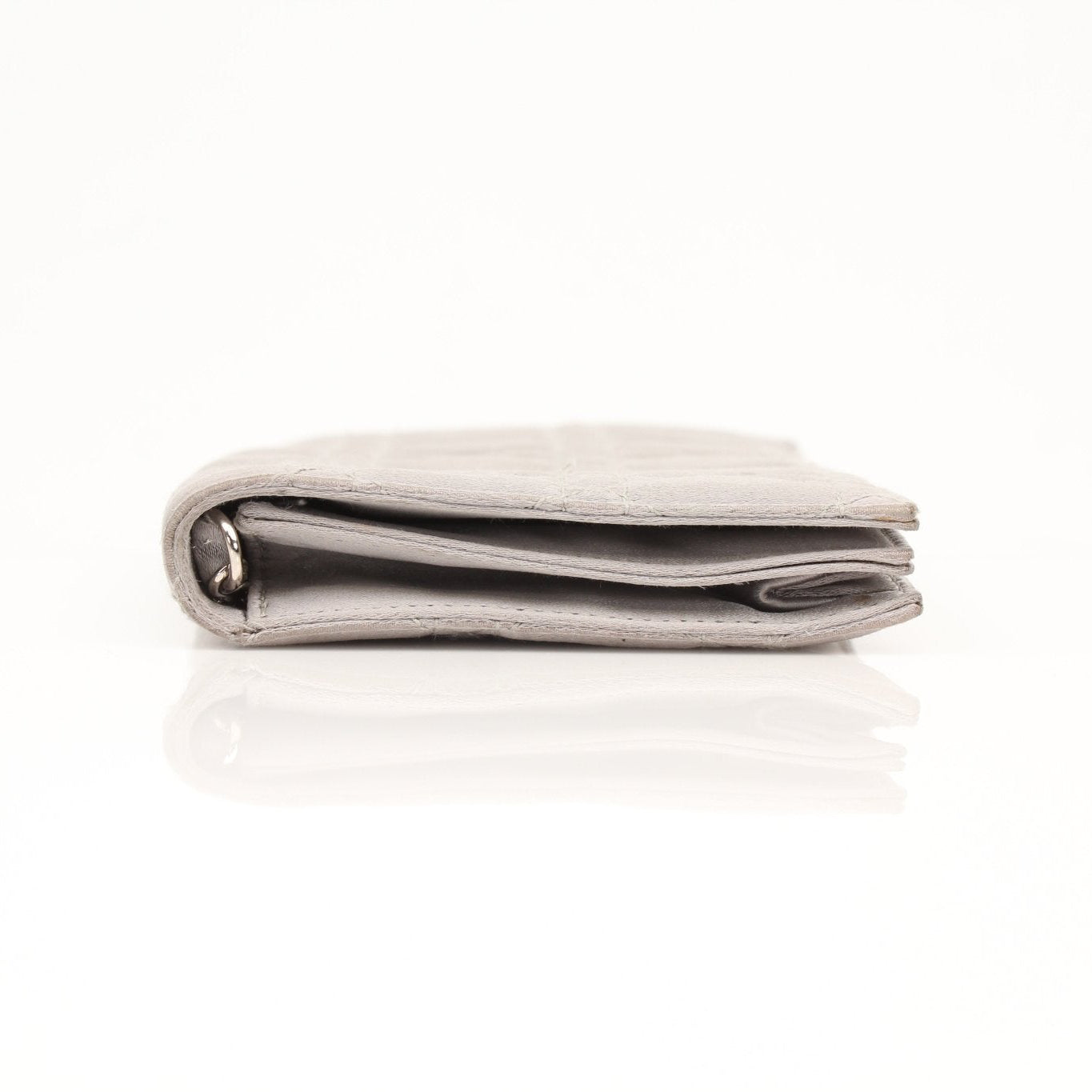 Gray satin Christian Dior Cannage clutch wallet with gold hardware, featuring quilted stitching and elegant design.