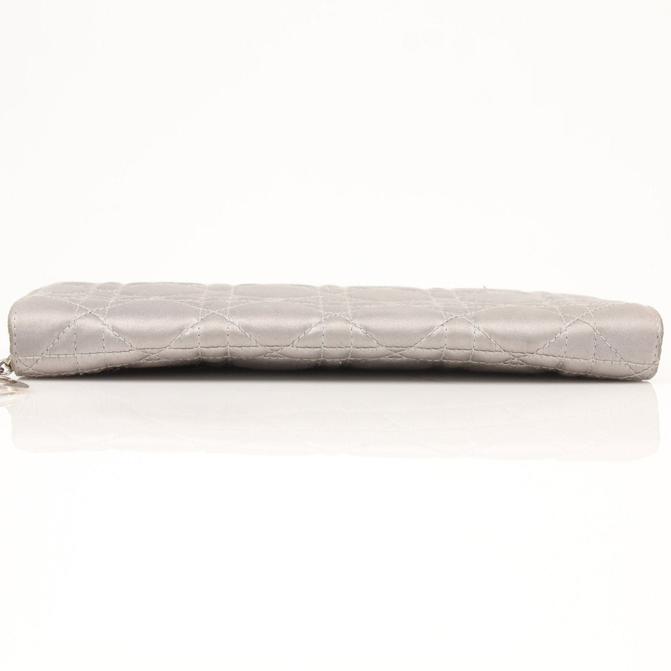 Gray satin Christian Dior Cannage clutch wallet with quilted design, featuring a sleek, elegant look for sophisticated accessories.