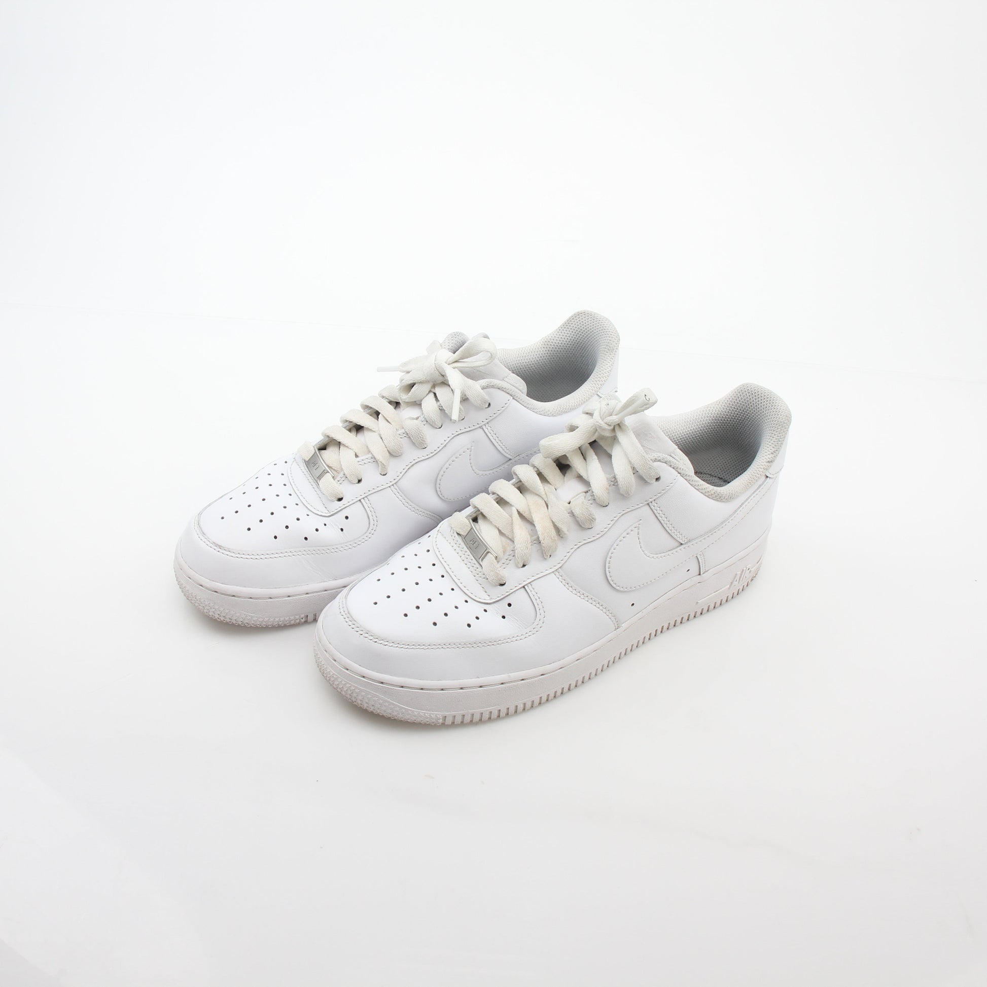 Nike White Air Force 1 ’07 Low sneakers by Gold & Beyond, showing the classic low-top design with white leather uppers.
