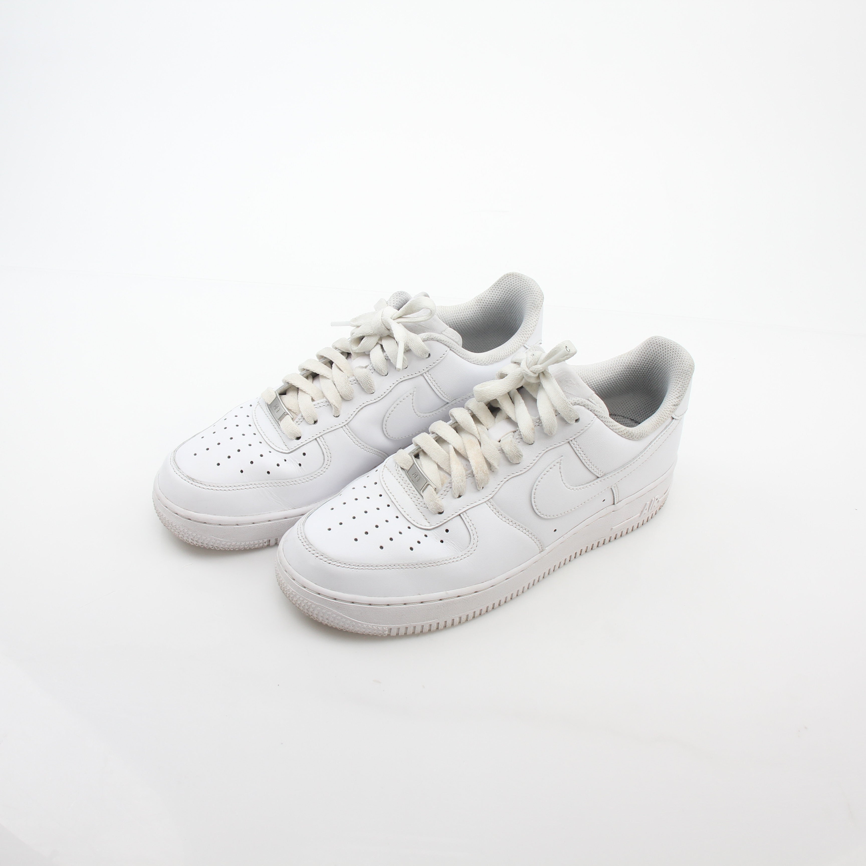 Nike White Air Force 1 ’07 Low sneakers by Gold & Beyond, showing the classic low-top design with white leather uppers.