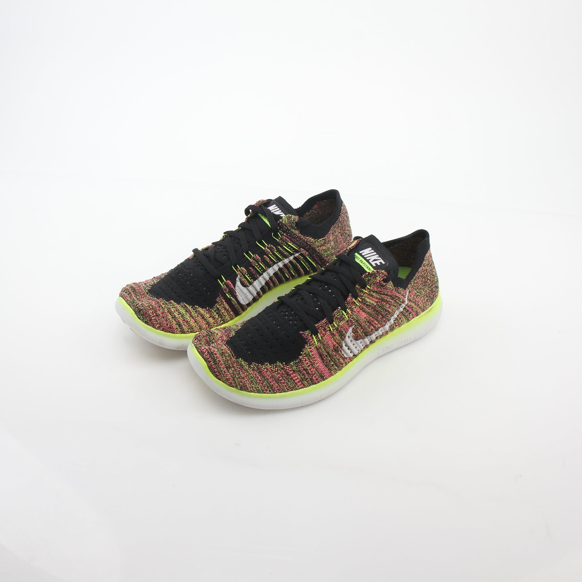 Nike Free RN Flyknit Unlimited sneakers in multicolor with breathable Flyknit upper and athletic sole, designed for running and sport.