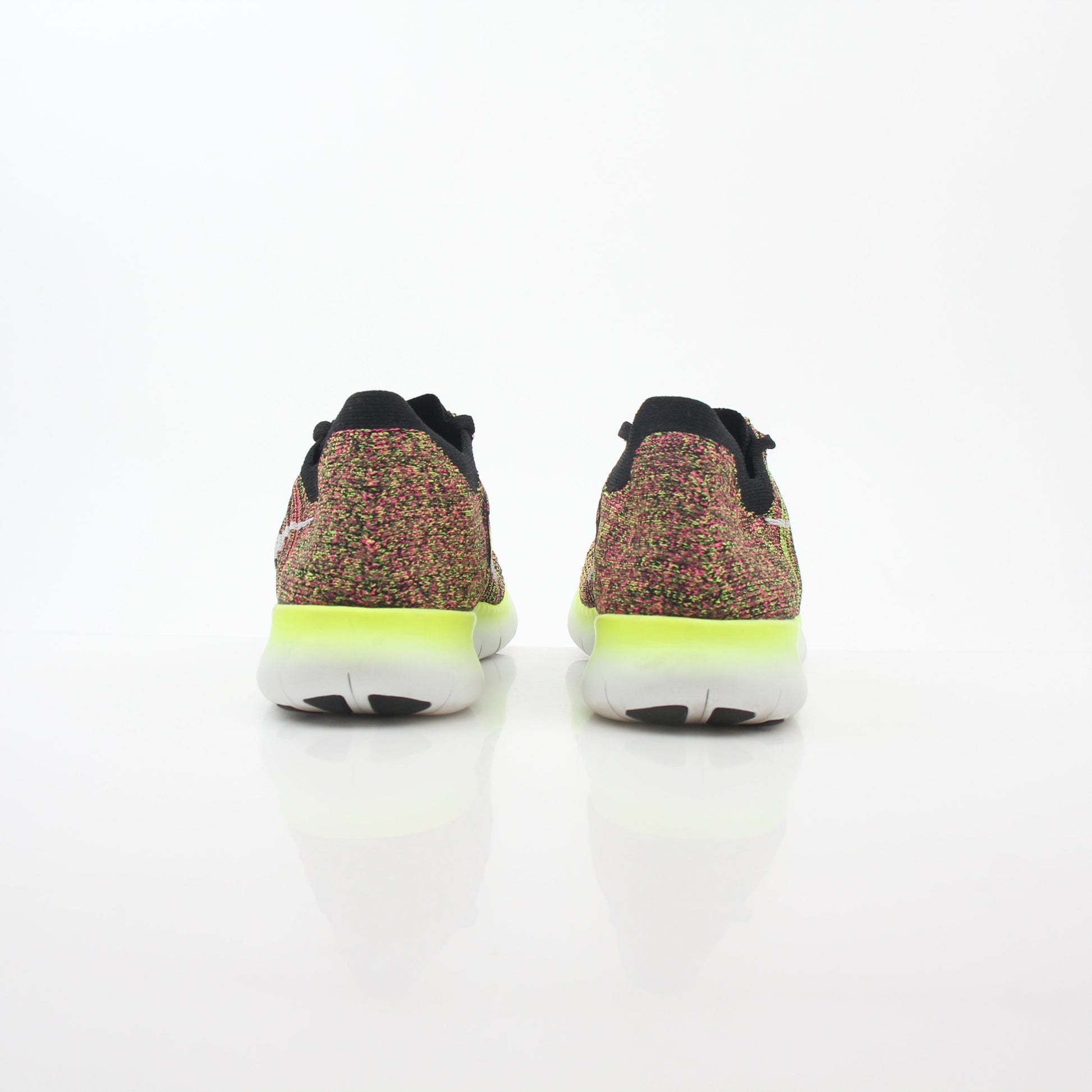 Nike Free RN Flyknit Unlimited multicolor sneakers by Gold & Beyond, featuring lightweight Flyknit upper and athletic shoe design.