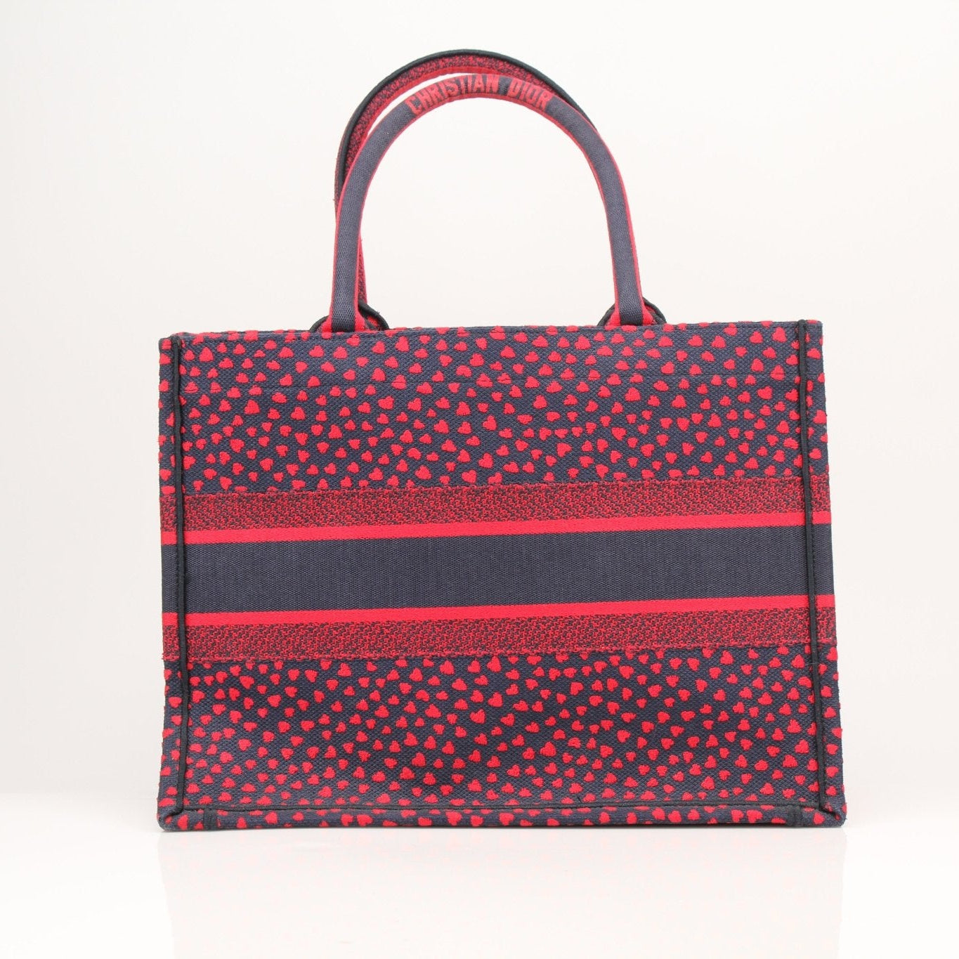 Christian Dior Book Tote handbag with heart embroidery, showcasing the elegant design and detailed craftsmanship.