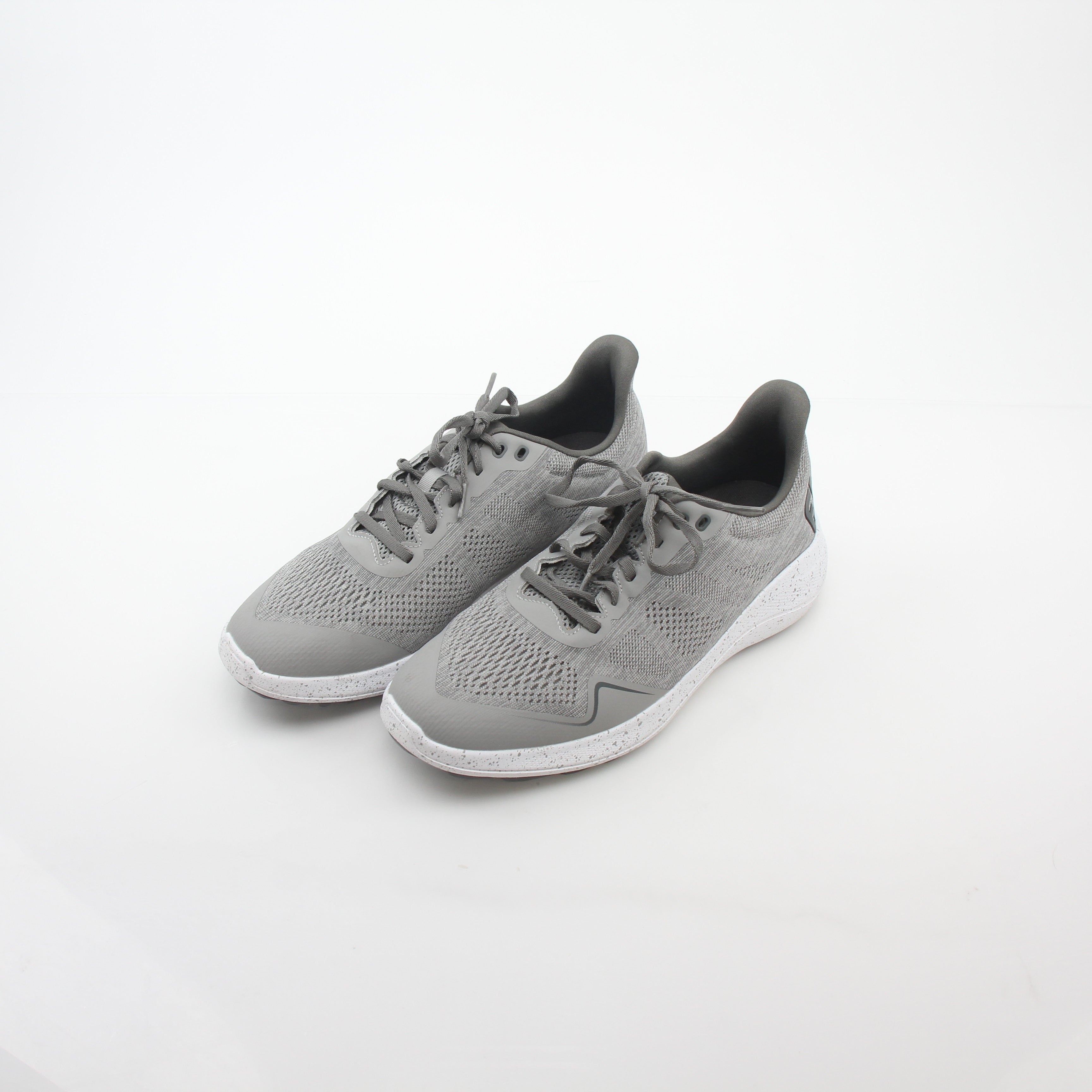 Gray FootJoy Flex spikeless golf shoes with sleek design and comfortable fit, featuring Gold & Beyond branding.