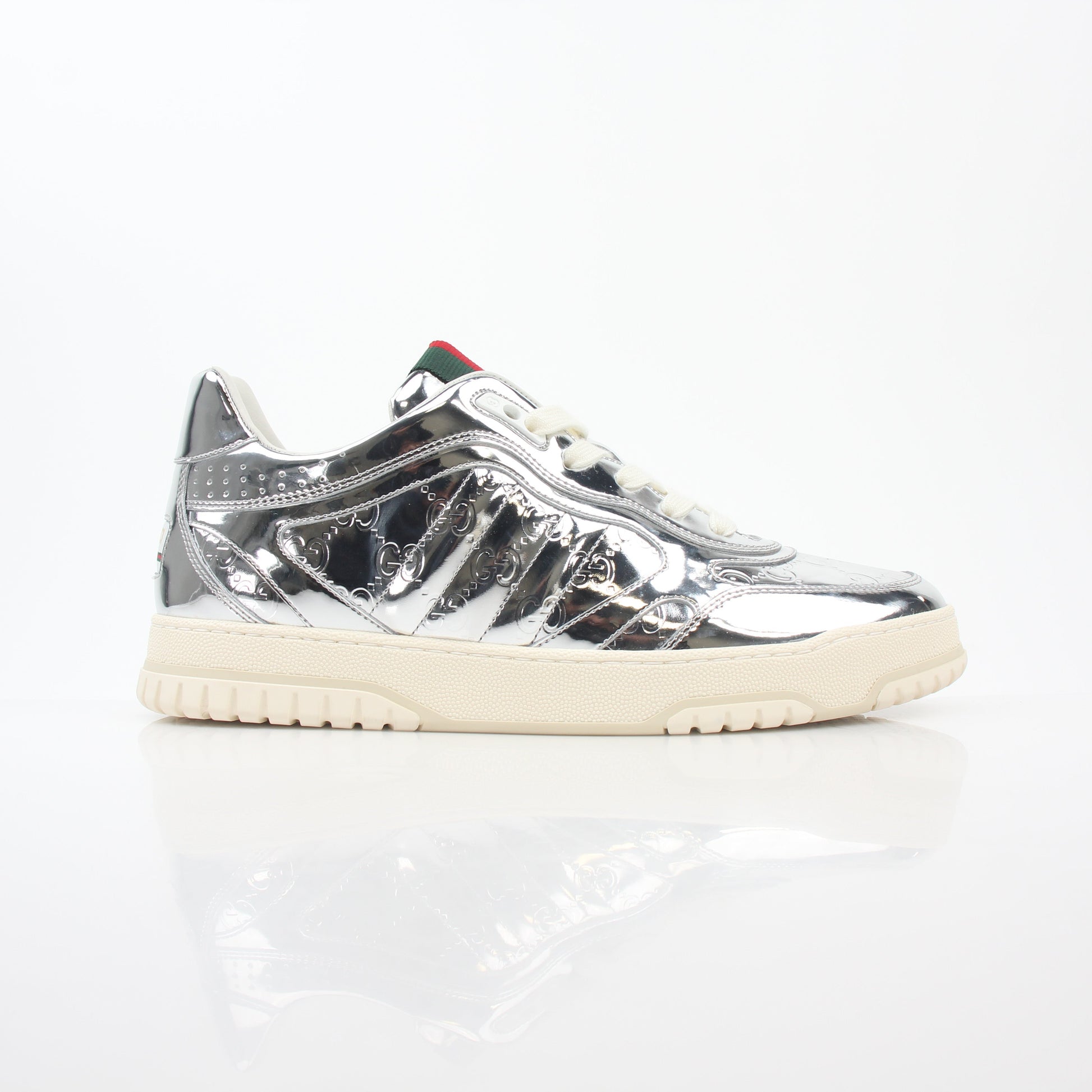 Gucci Silver Metallic Re-Web Sneakers, stylish shoes with metallic finish and signature web detail, on a plain background.