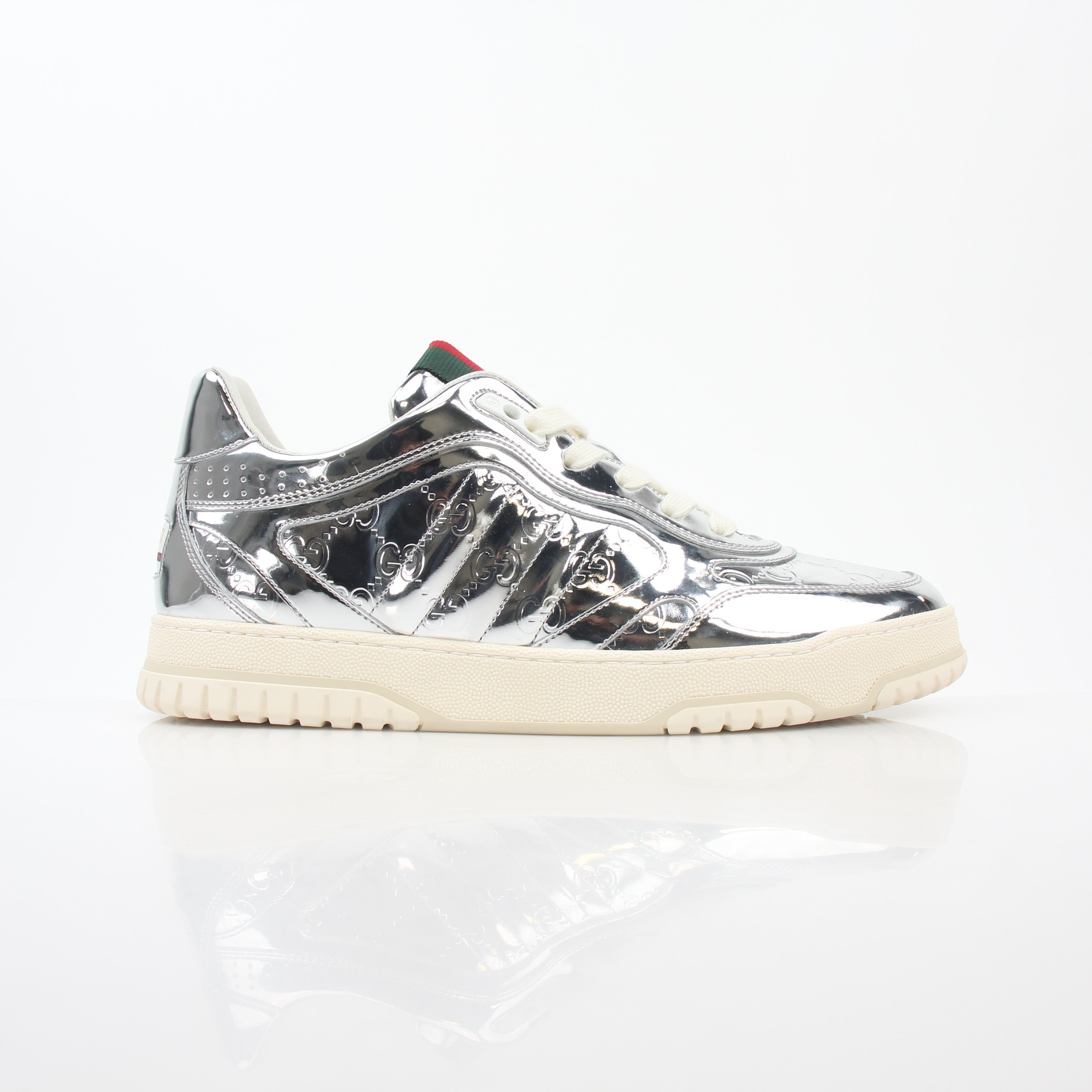 Gucci Silver Metallic Re-Web Sneakers, stylish shoes with metallic finish and signature web detail, on a plain background.