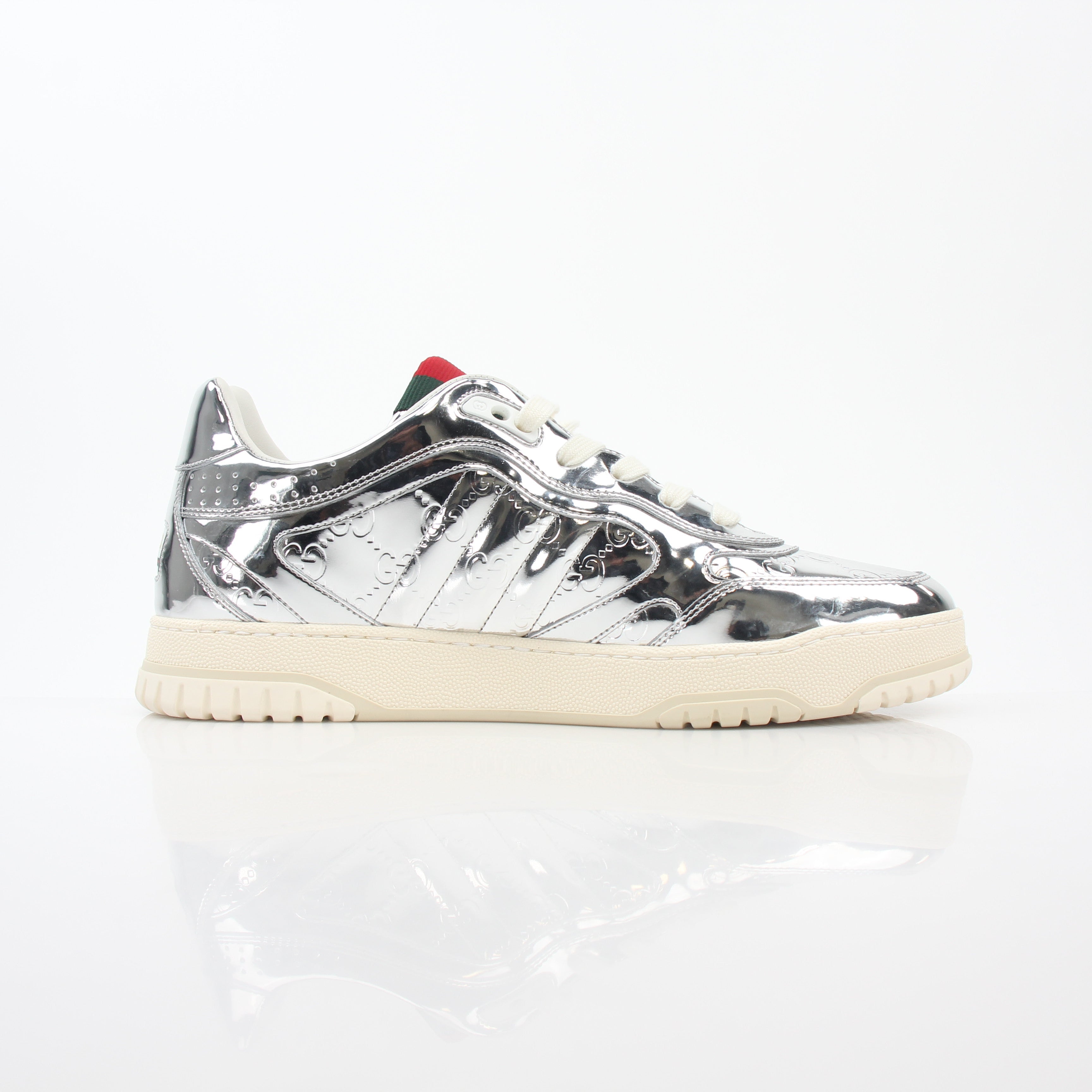 Gucci Silver Metallic Re-Web Sneakers, stylish shoes with metallic silver finish and signature web design, on a clean background.
