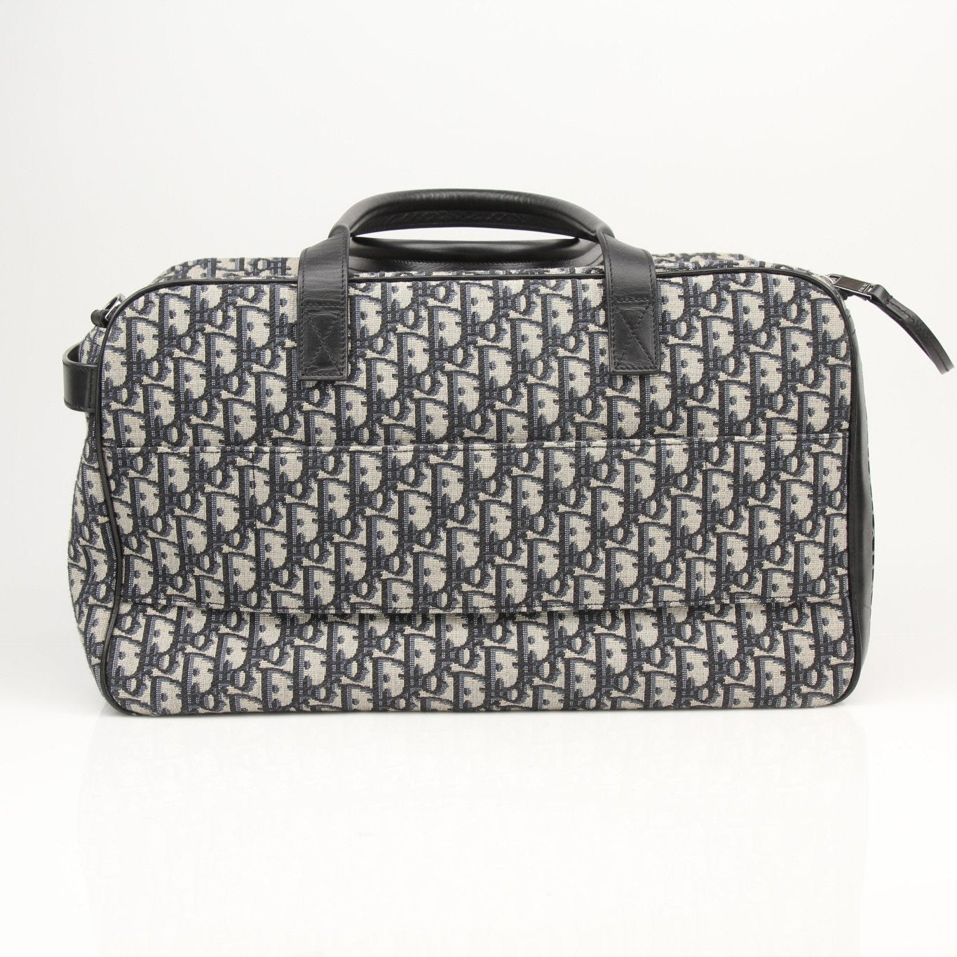 Christian Dior Oblique dog carrier travel bag by Gold & Beyond, featuring stylish fabric and secure carrying handles.