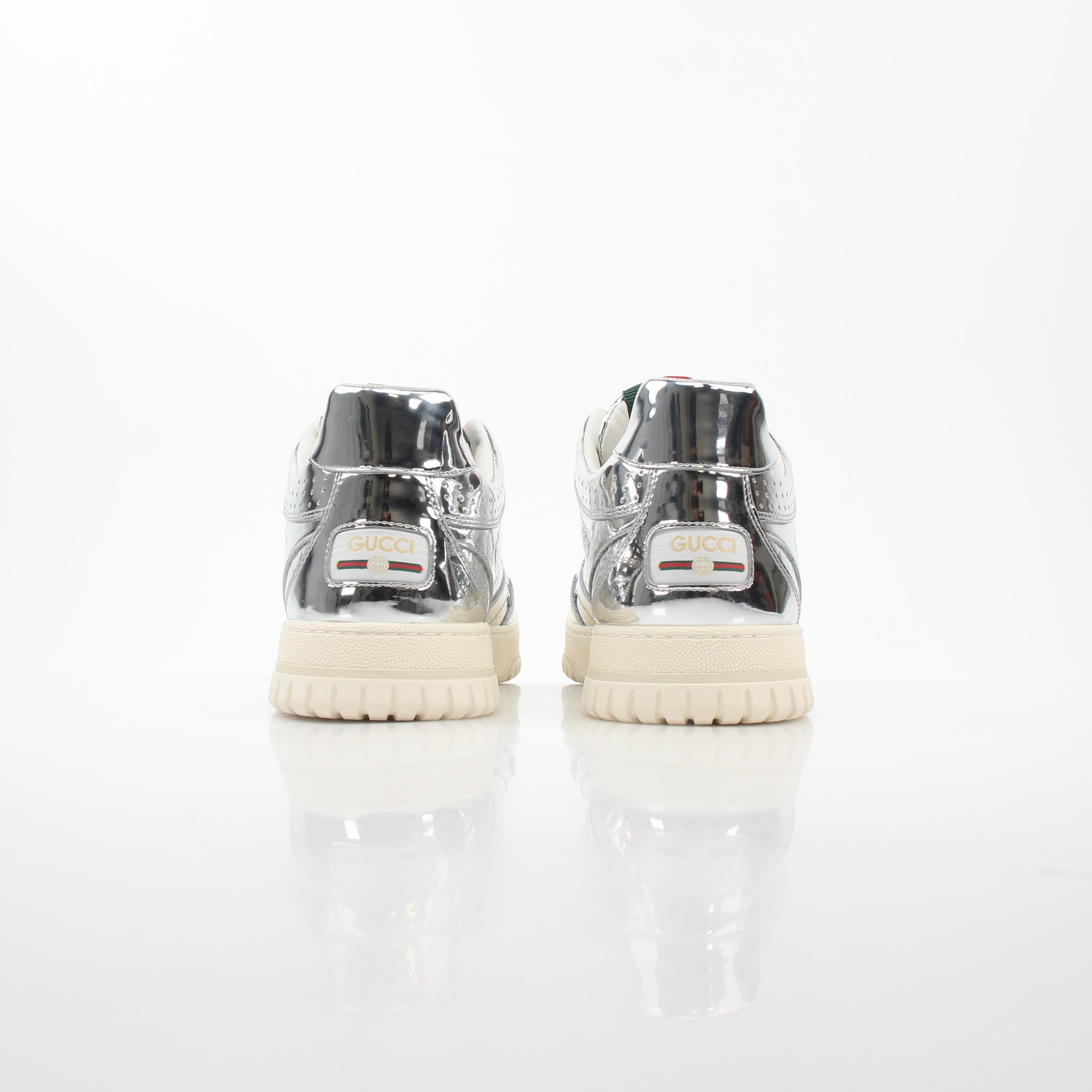 Gucci Silver Metallic Re-Web sneakers featuring shiny metallic finish and signature web detail, designed for stylish casual wear.