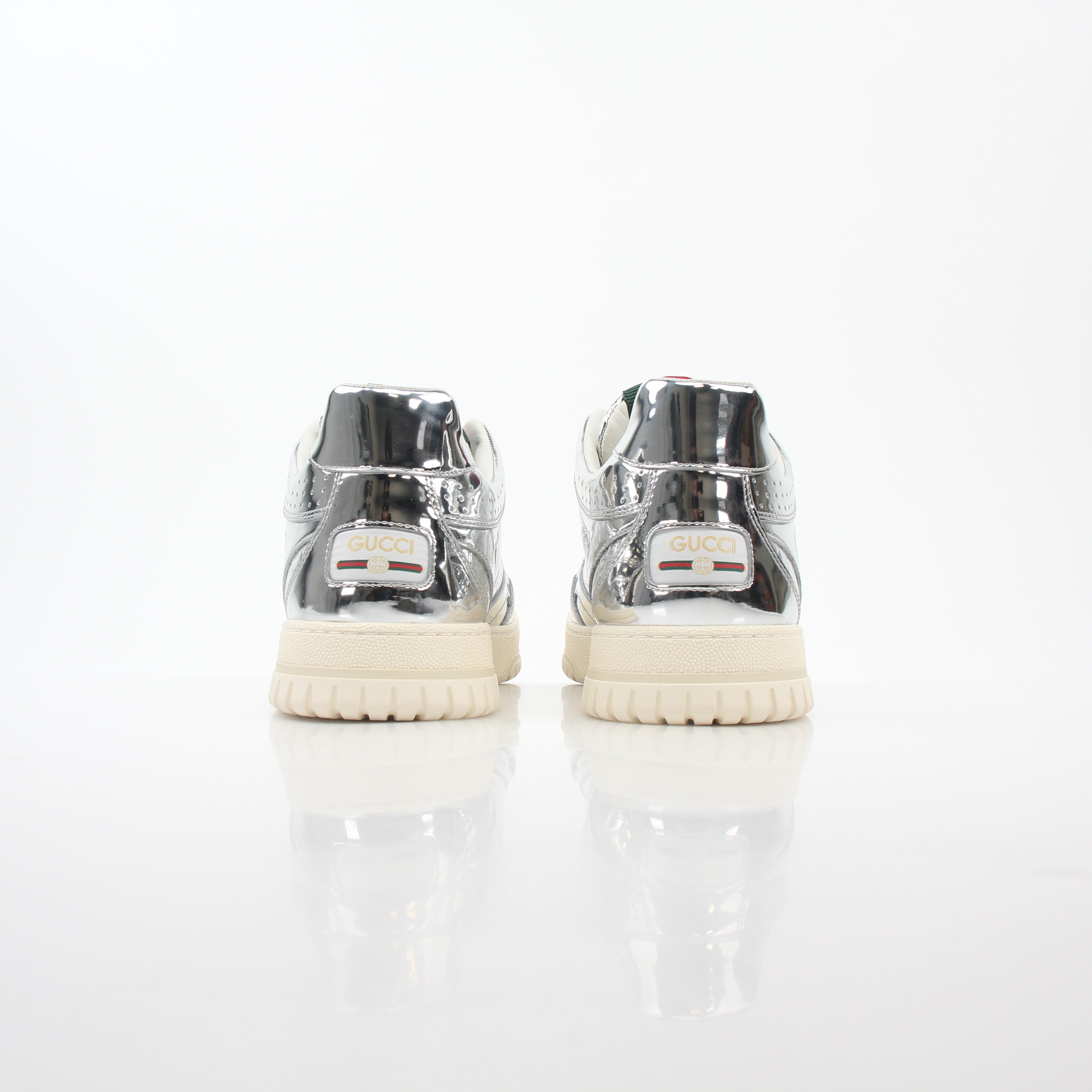 Gucci Silver Metallic Re-Web sneakers featuring shiny metallic finish and signature web detail, designed for stylish casual wear.