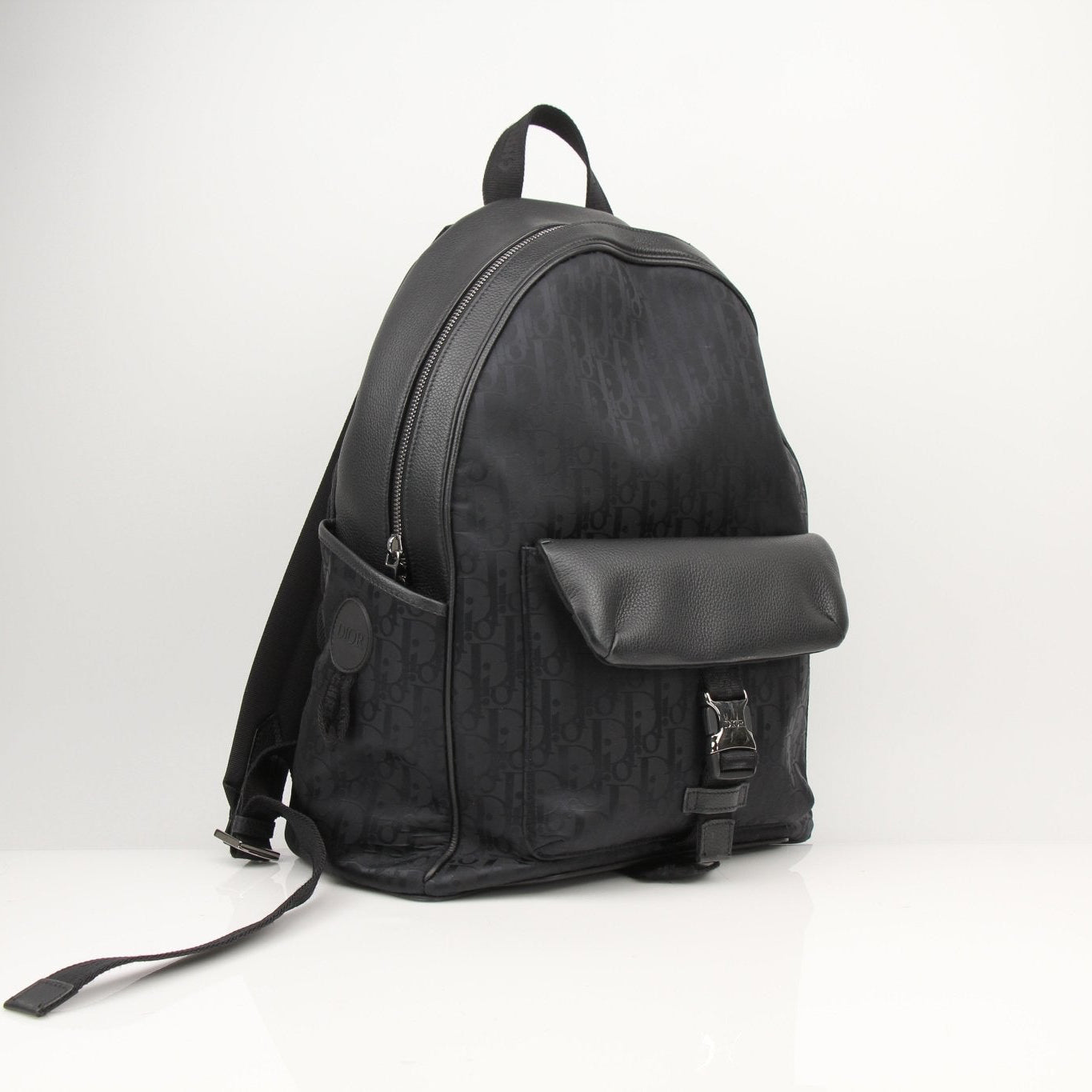 Christian Dior Oblique nylon backpack from Gold & Beyond, stylish travel bag with monogram pattern and adjustable straps.