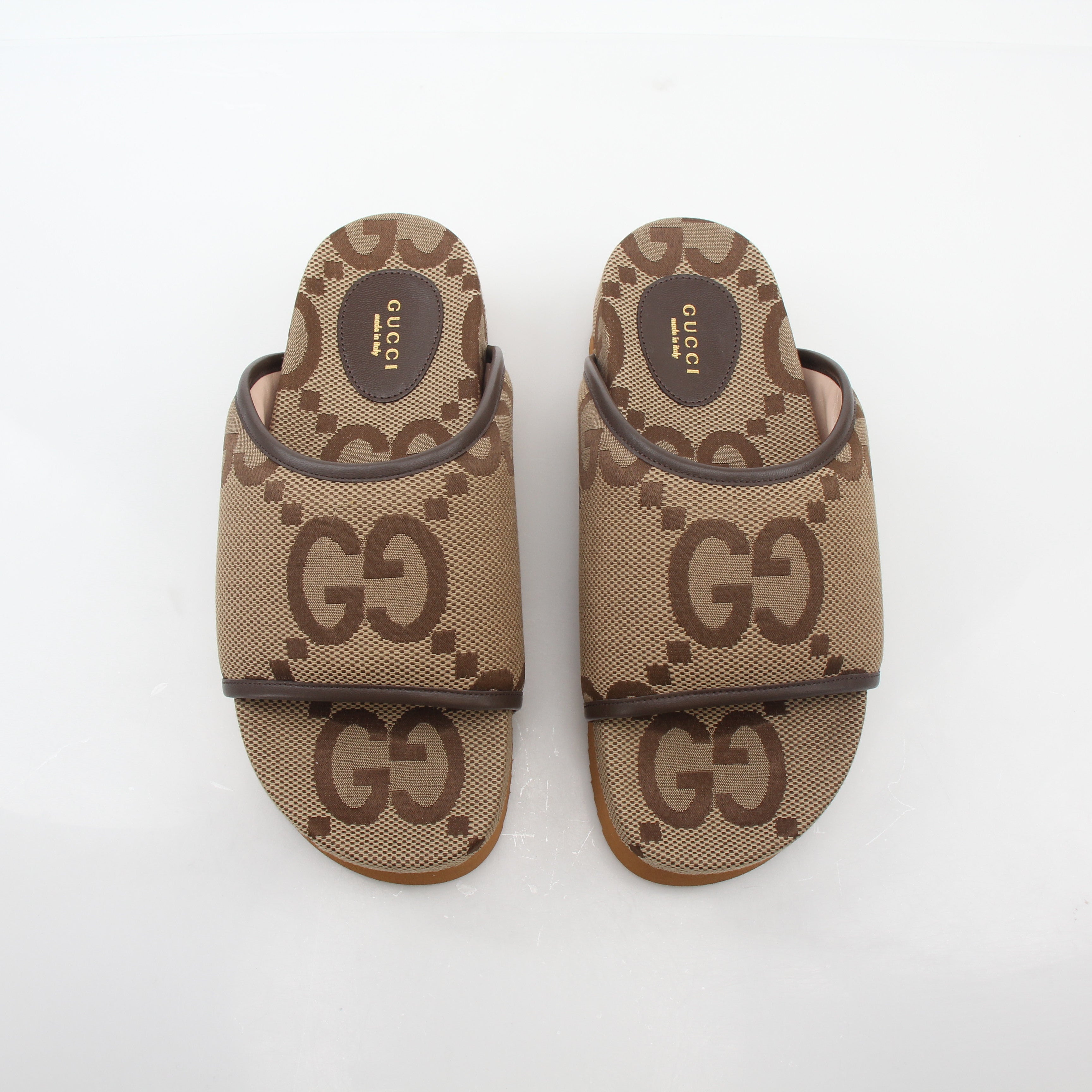 Gold & Beyond Gucci brown maxi GG platform slide sandals, stylish shoes with bold logo design and comfortable slip-on style.
