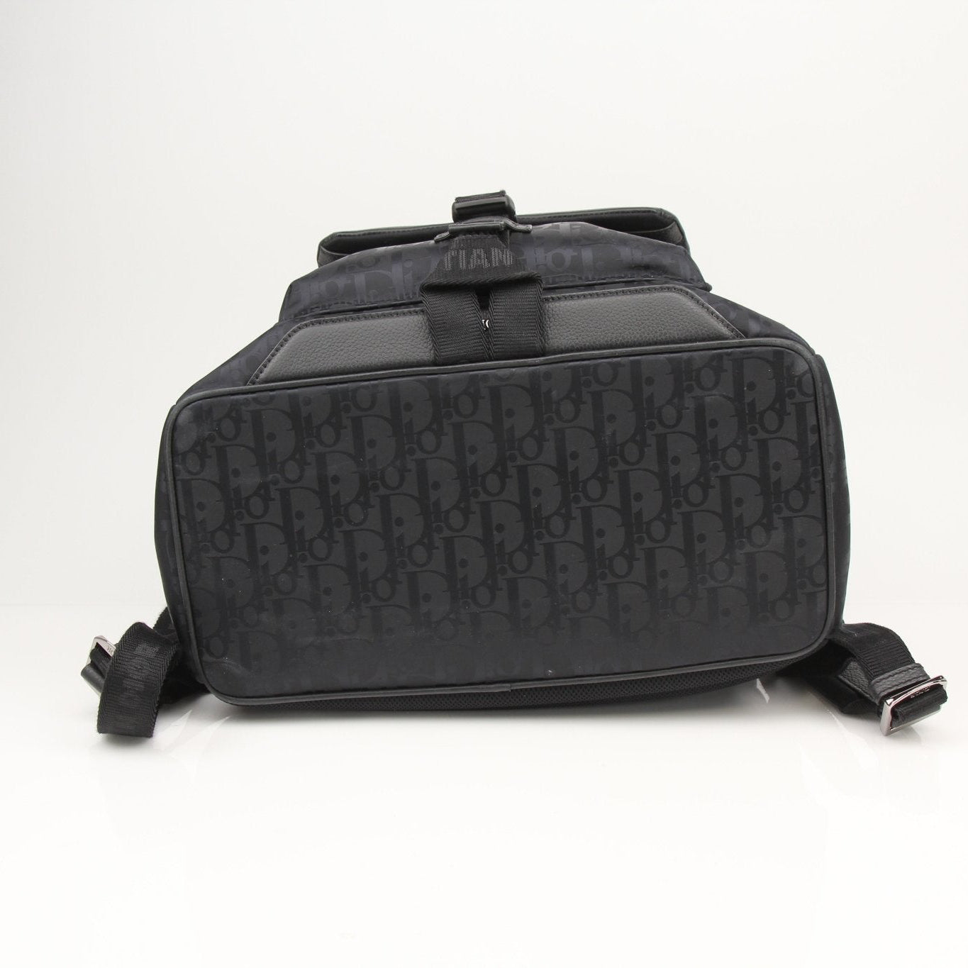 Christian Dior Oblique nylon backpack featuring adjustable straps and multiple compartments, ideal for travel and everyday use.